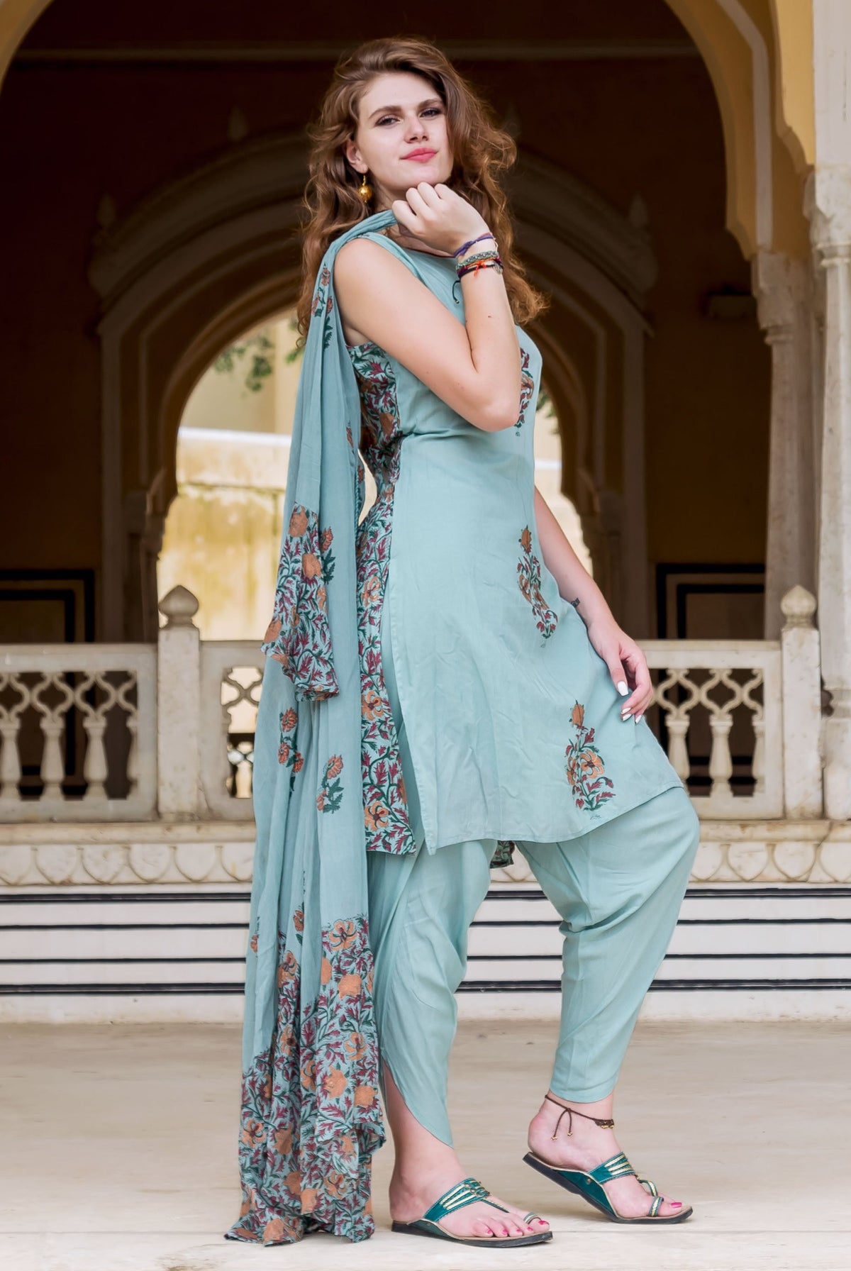 Full-length model in Turkish blue hand block printed kurta, dhoti pants, and floral dupatta.
