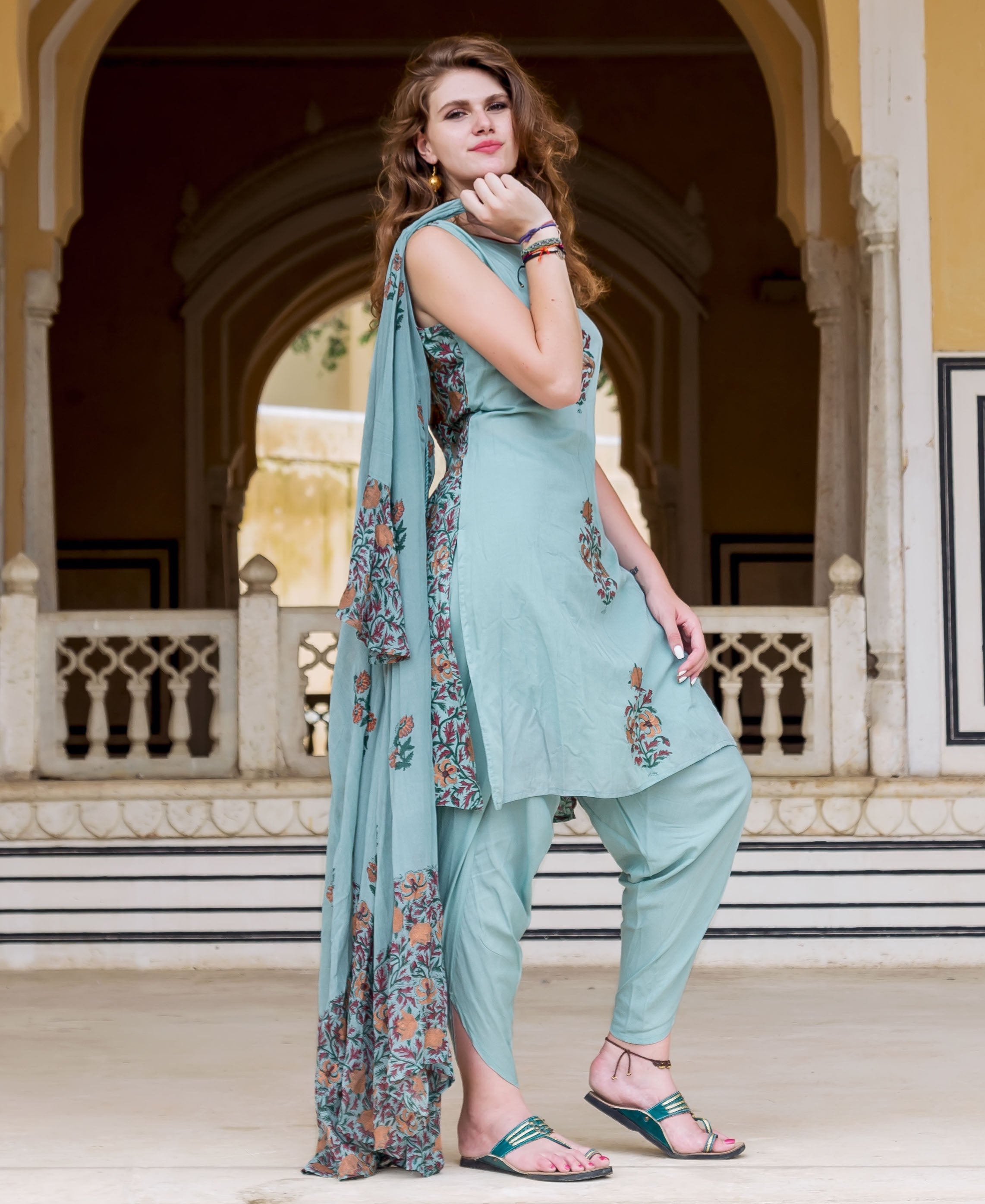Full-length model in Turkish blue hand block printed kurta, dhoti pants, and floral dupatta.