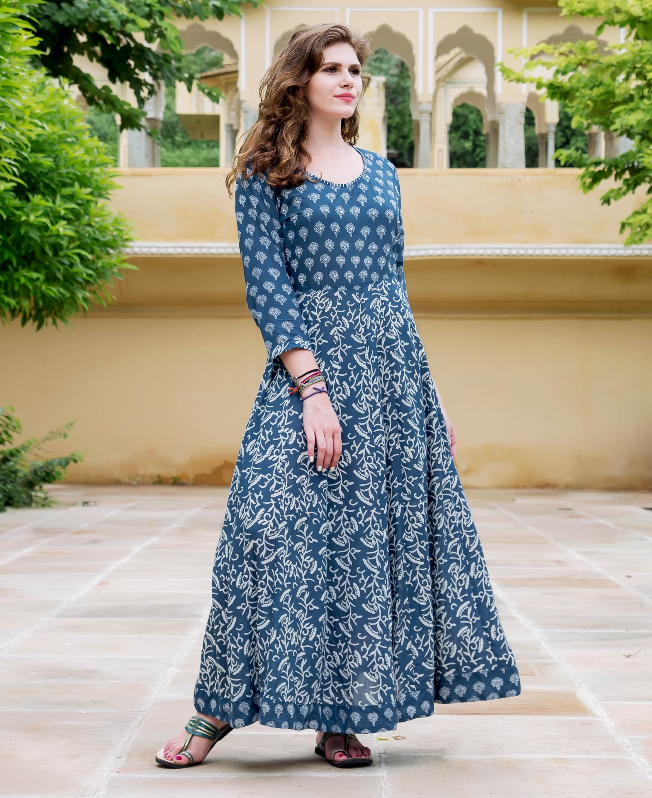 Full-length front view of model in an indigo hand-block-printed ethnic flared dress.