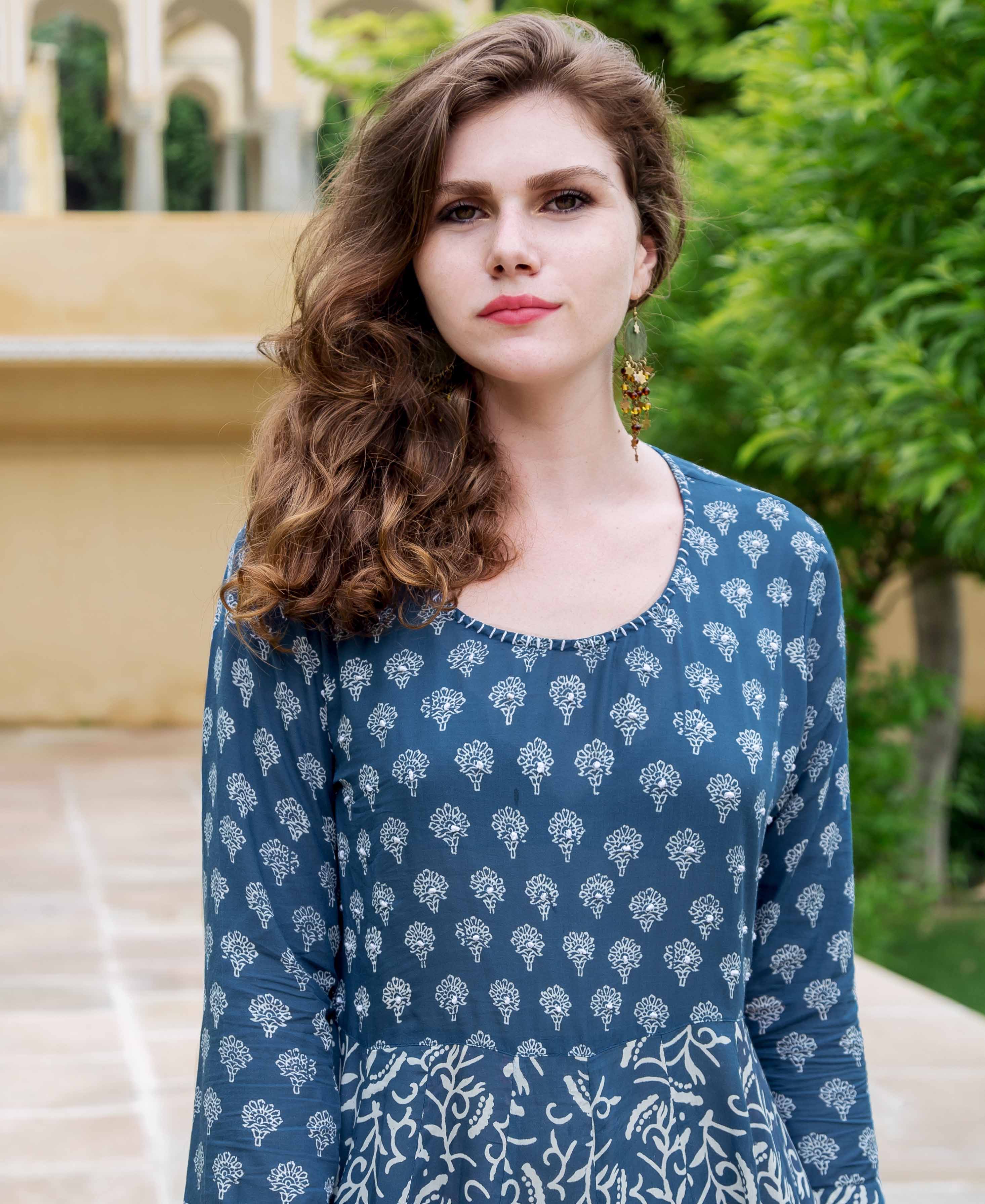 Front view of model in indigo blue flared dress with white dual hand-block prints.