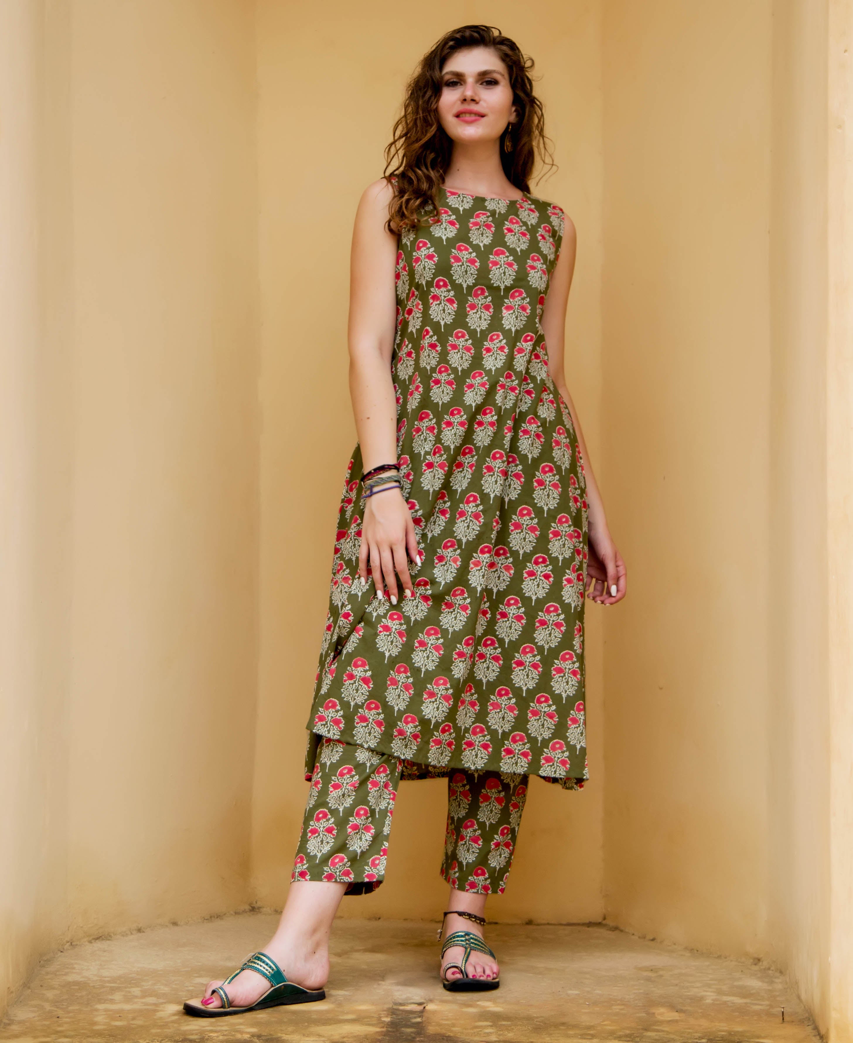 Full-length model in olive green and red floral hand-block-printed ethnic kurta set.