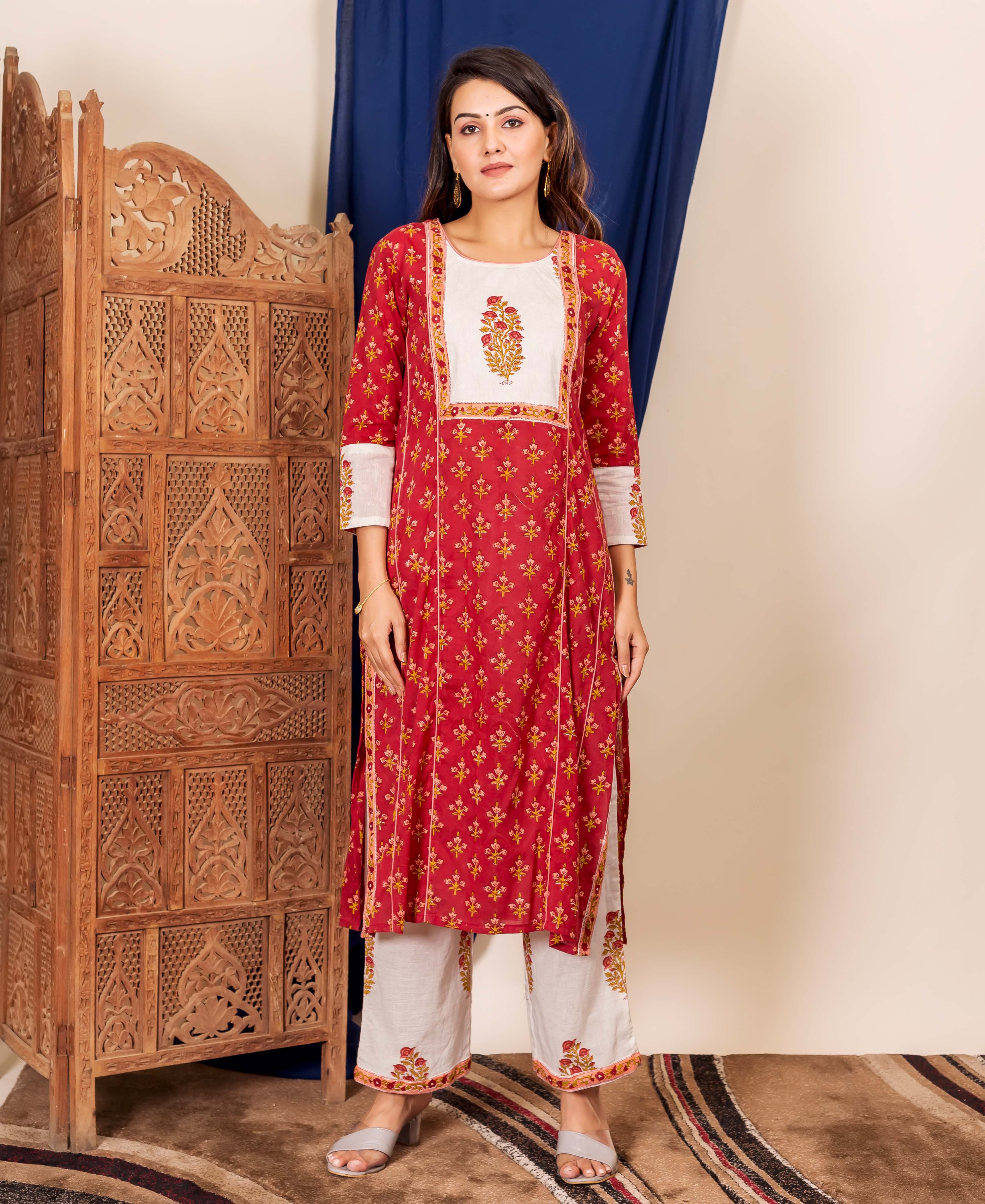 Full-length model in maroon and peach hand-block printed kurta and white floral palazzo.
