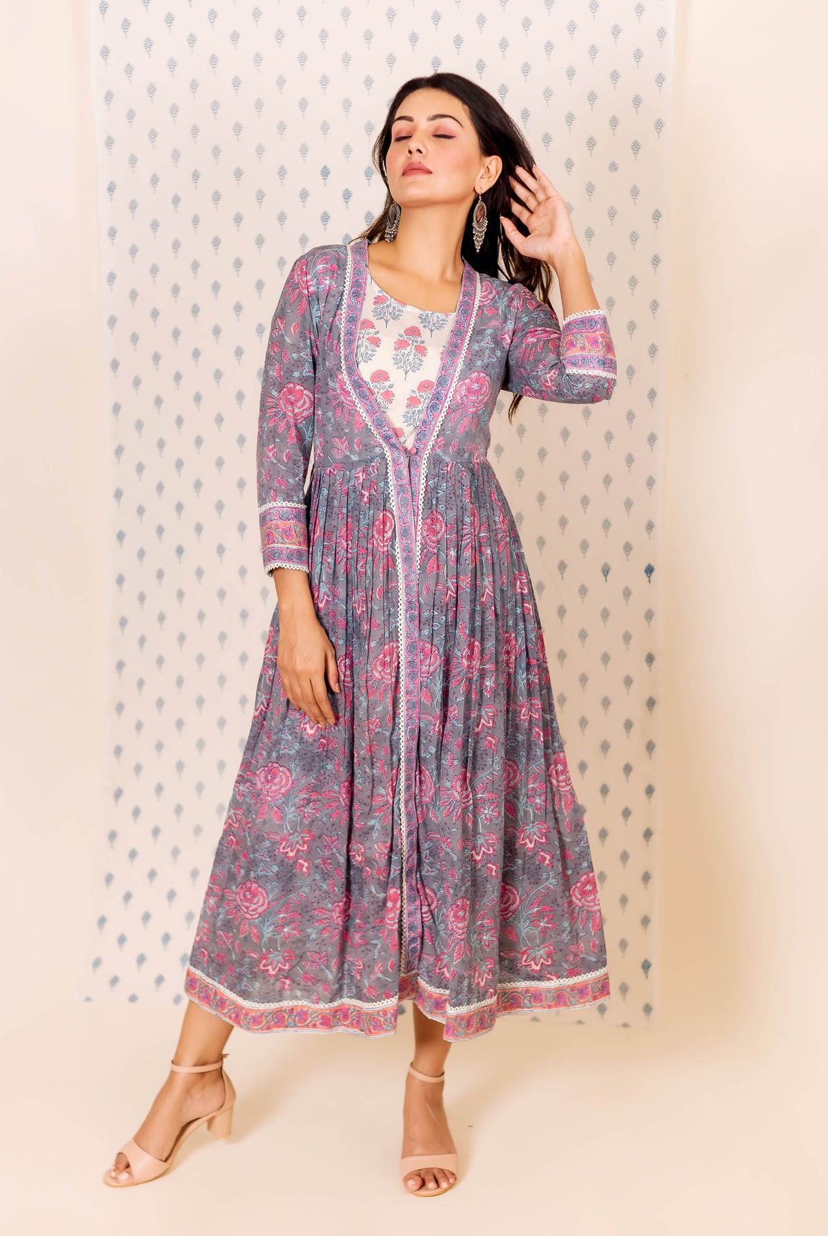 Front view of model wearing grey and pink misprint hand block printed dress with inner.