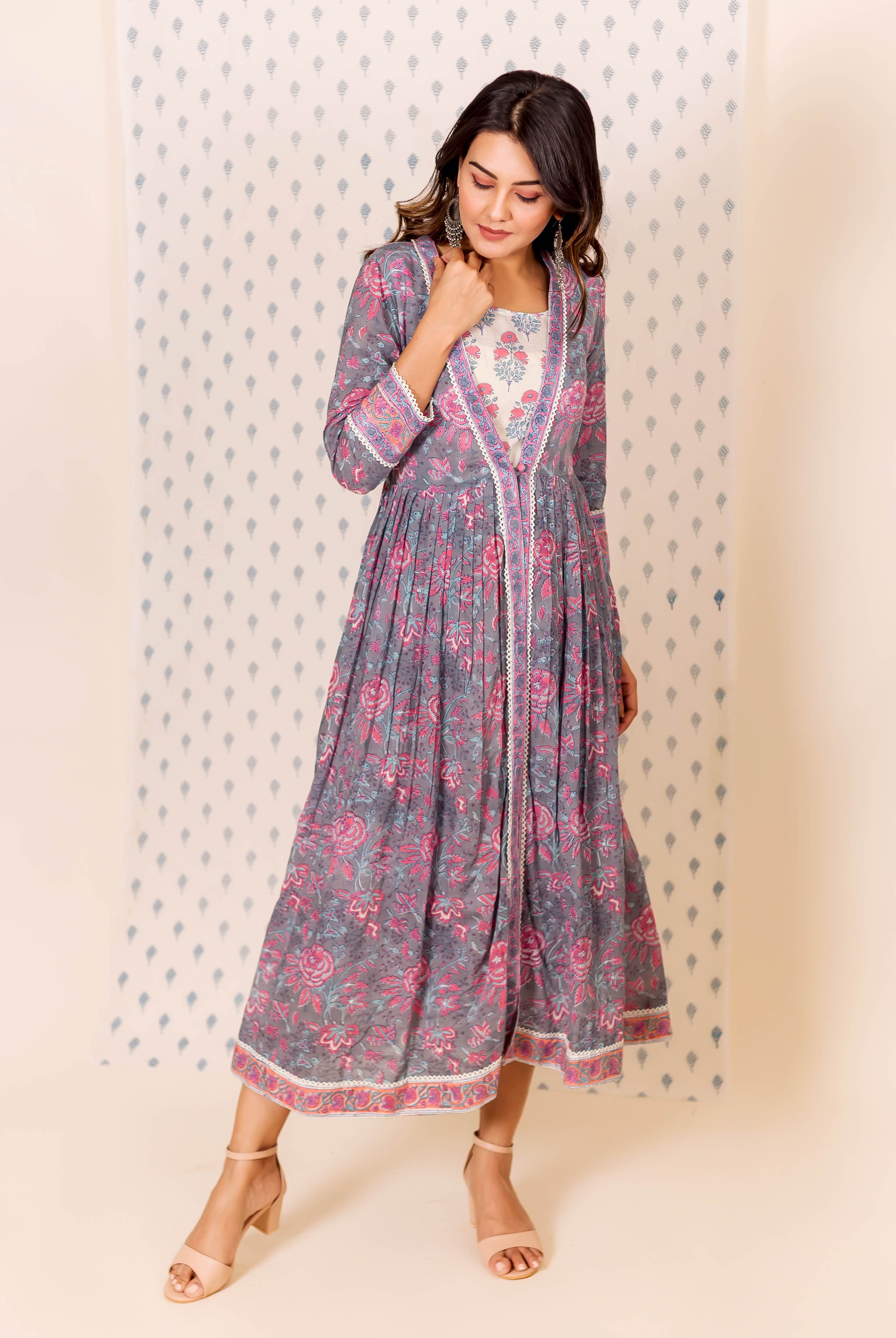Model in full-length grey and pink hand block printed dress with inner.