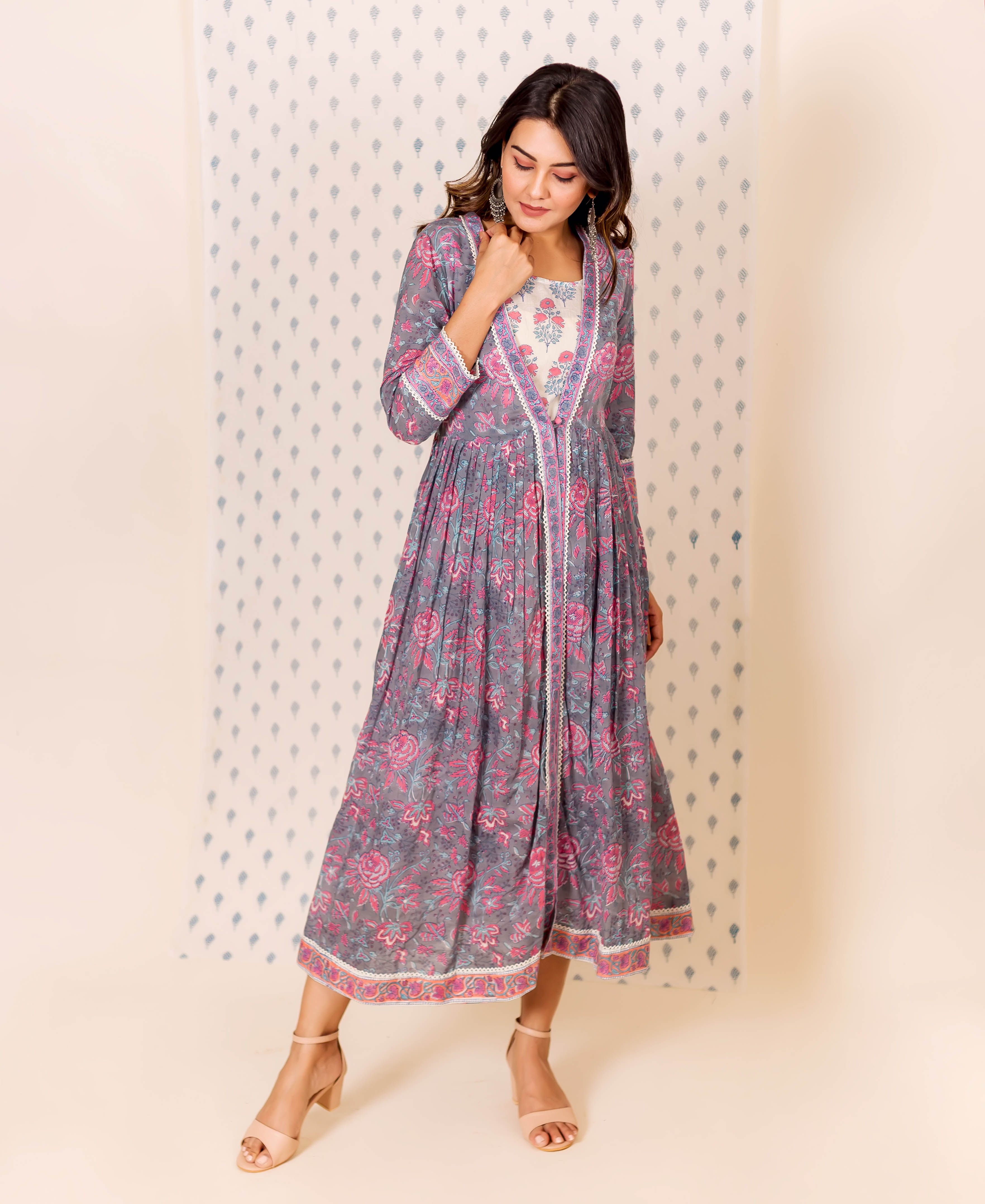 Model in full-length grey and pink hand block printed dress with inner.