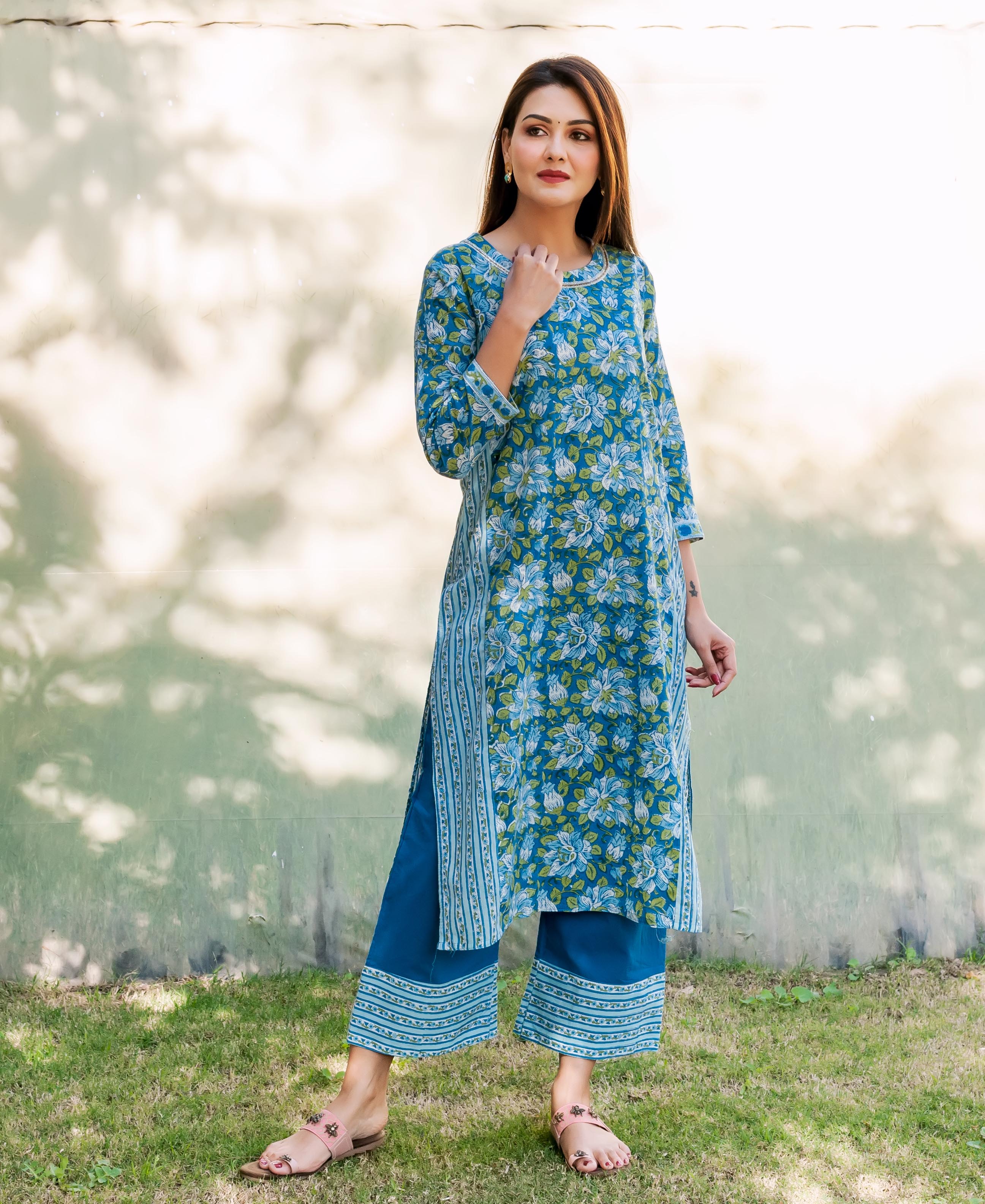 Full length view of model in a sapphire blue floral hand block printed kurta set.