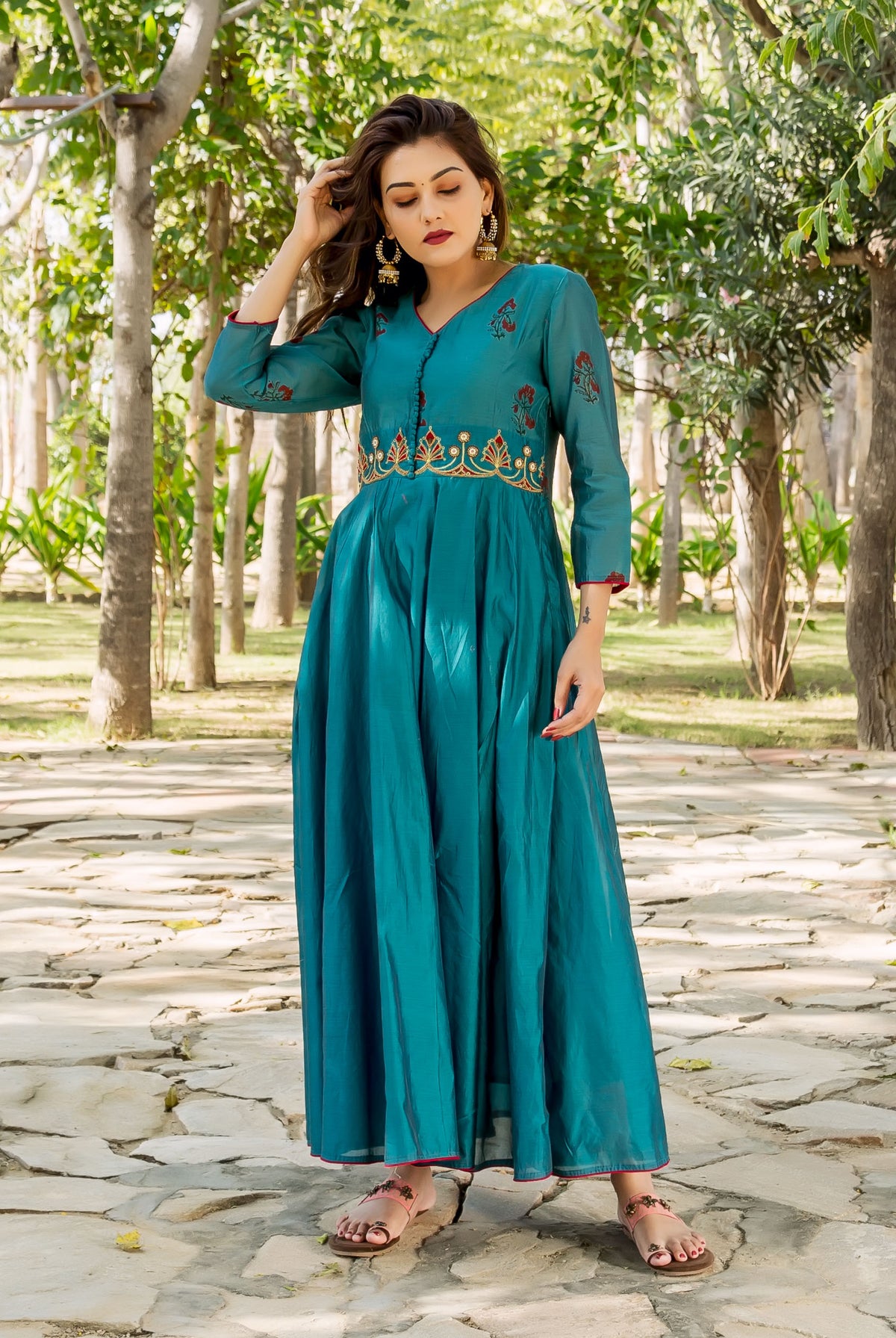 Teal hand-embroidered and block-printed ethnic kurta with gold yoke on model.