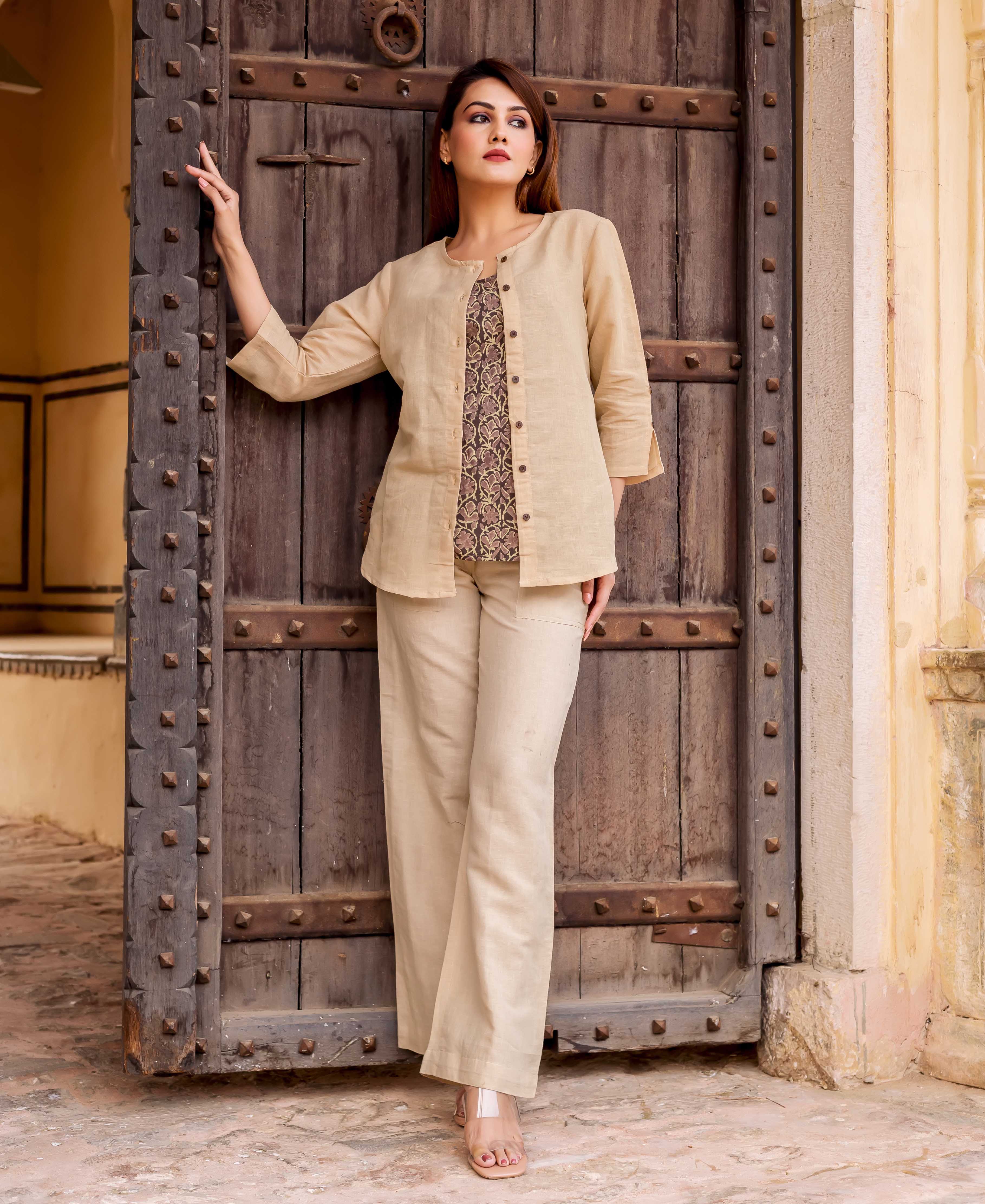 Model in beige linen coordinated set: open jacket, hand-block-printed ethnic top, wide-leg pants.