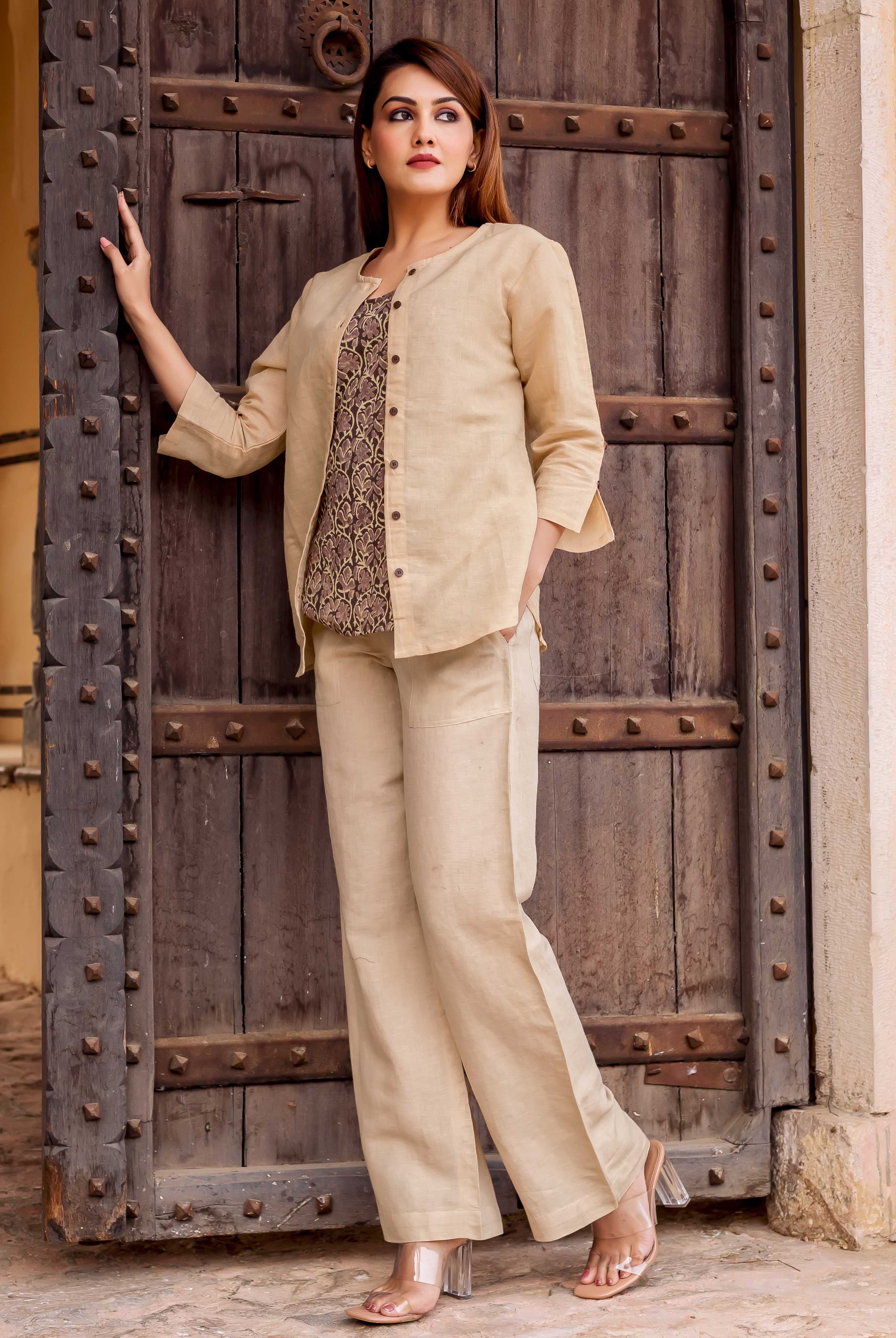 Front full look of model in beige linen set with hand-block-printed ethnic inner top.