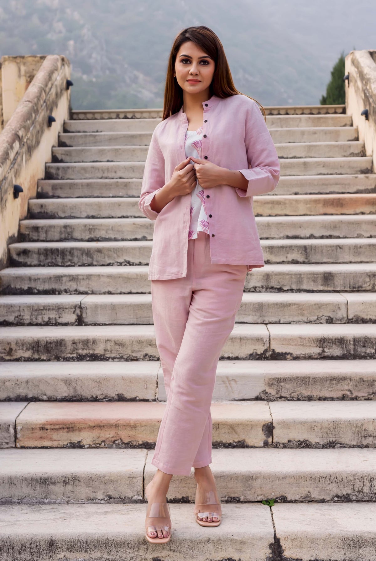 Full view of model wearing a flamingo pink linen coordinated set with printed top.