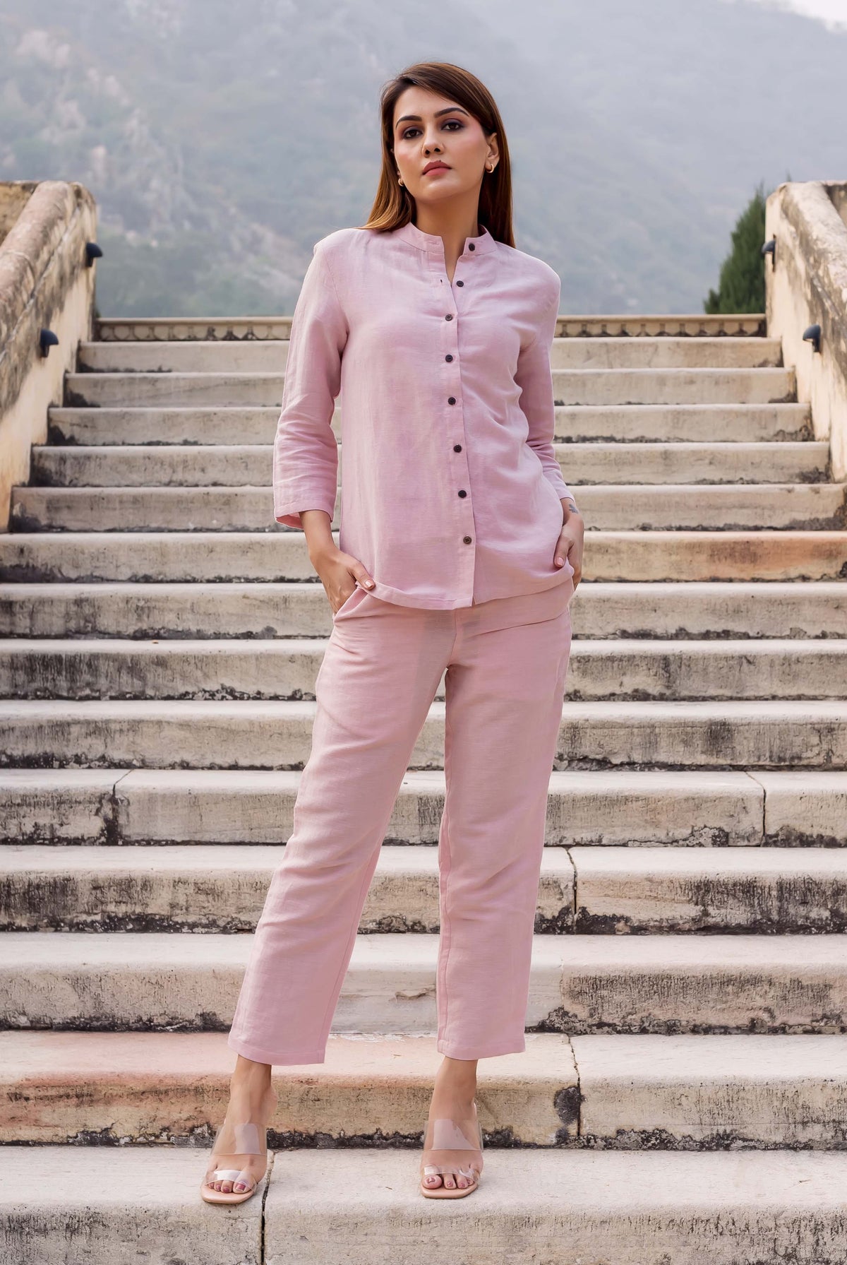Model in front-facing full look of solid flamingo pink linen coordinated set.