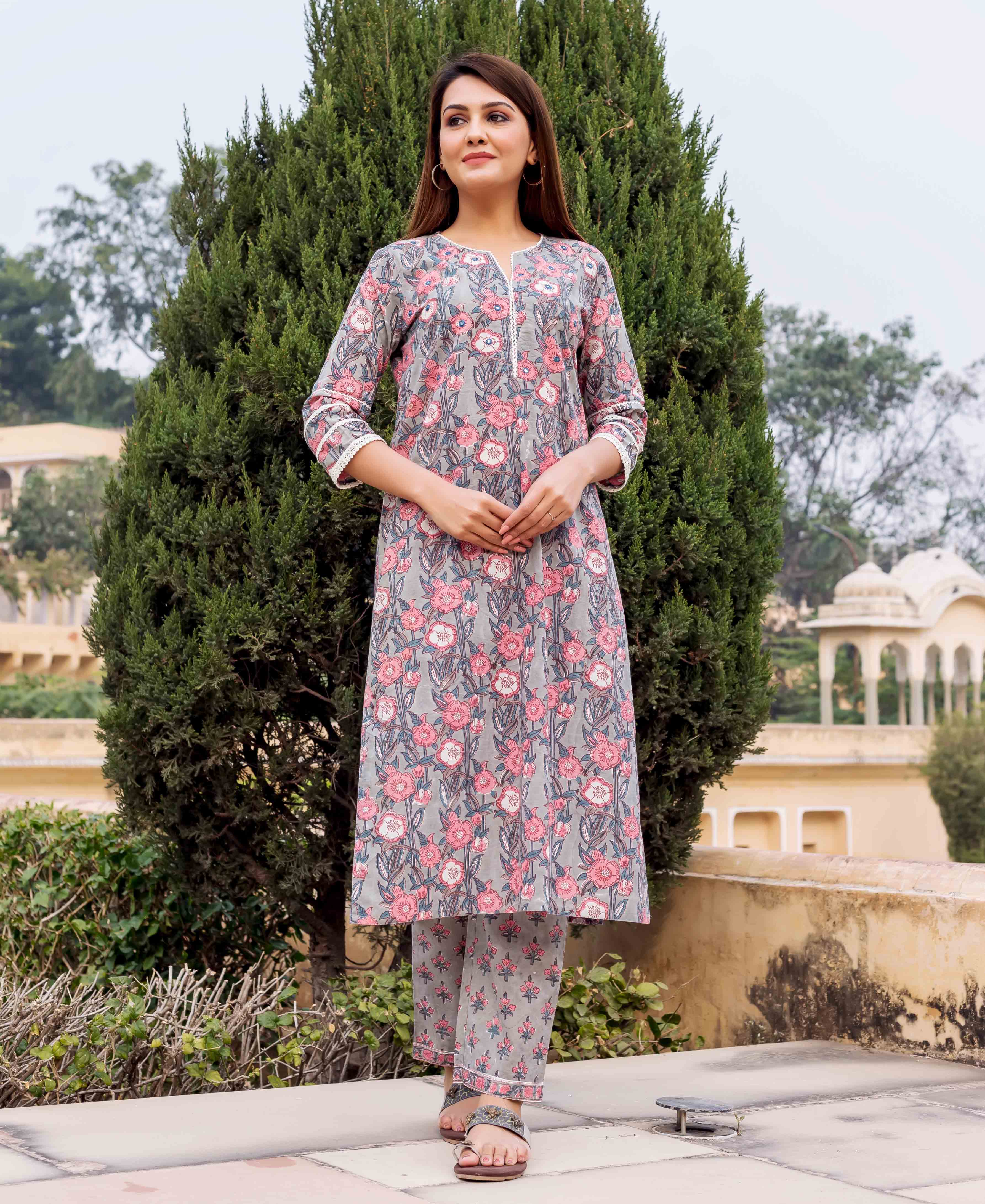 Grey and pink hand block printed kurta on a model, front view.