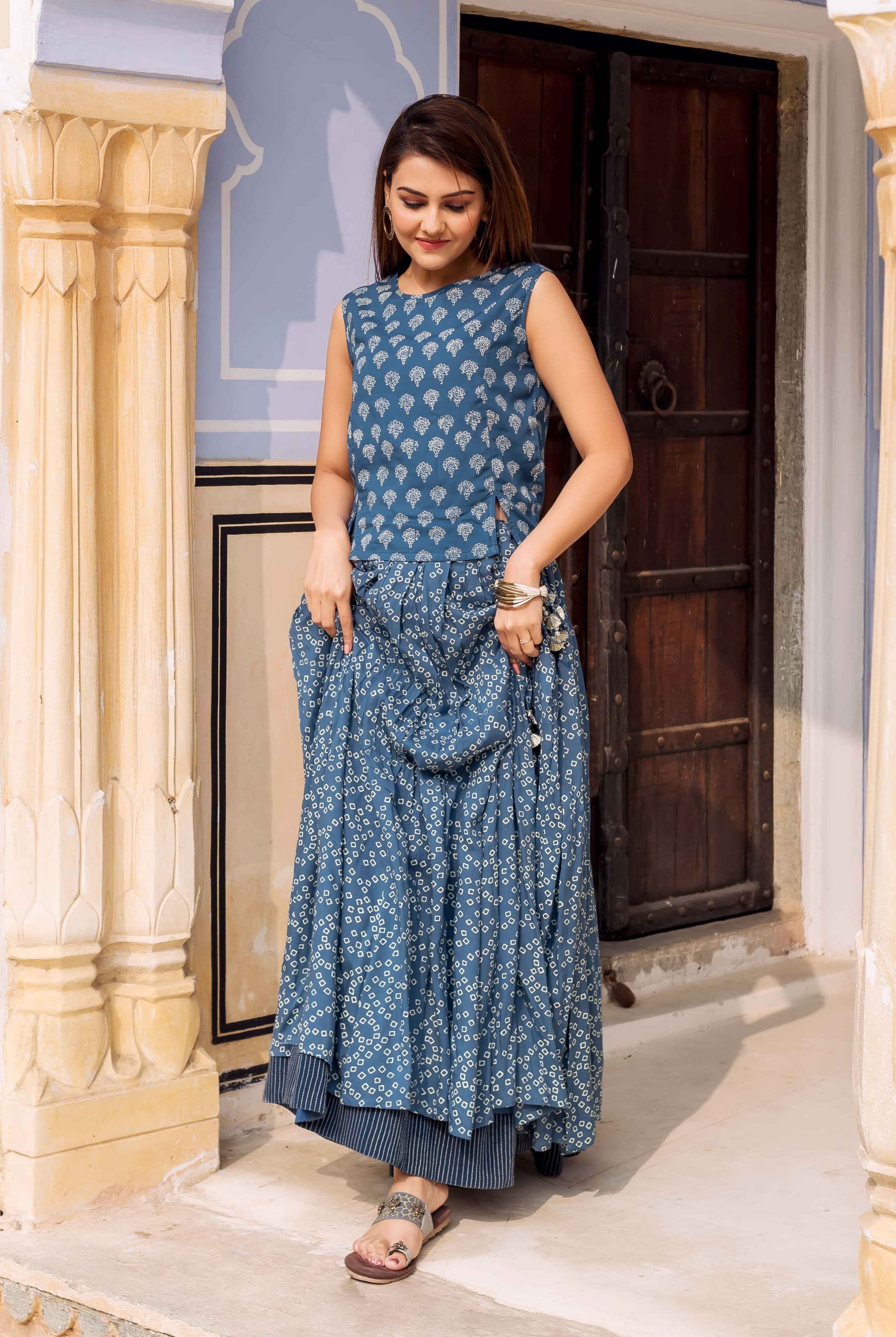 Front full look: model in an indigo hand-block-printed sleeveless top and matching skirt.