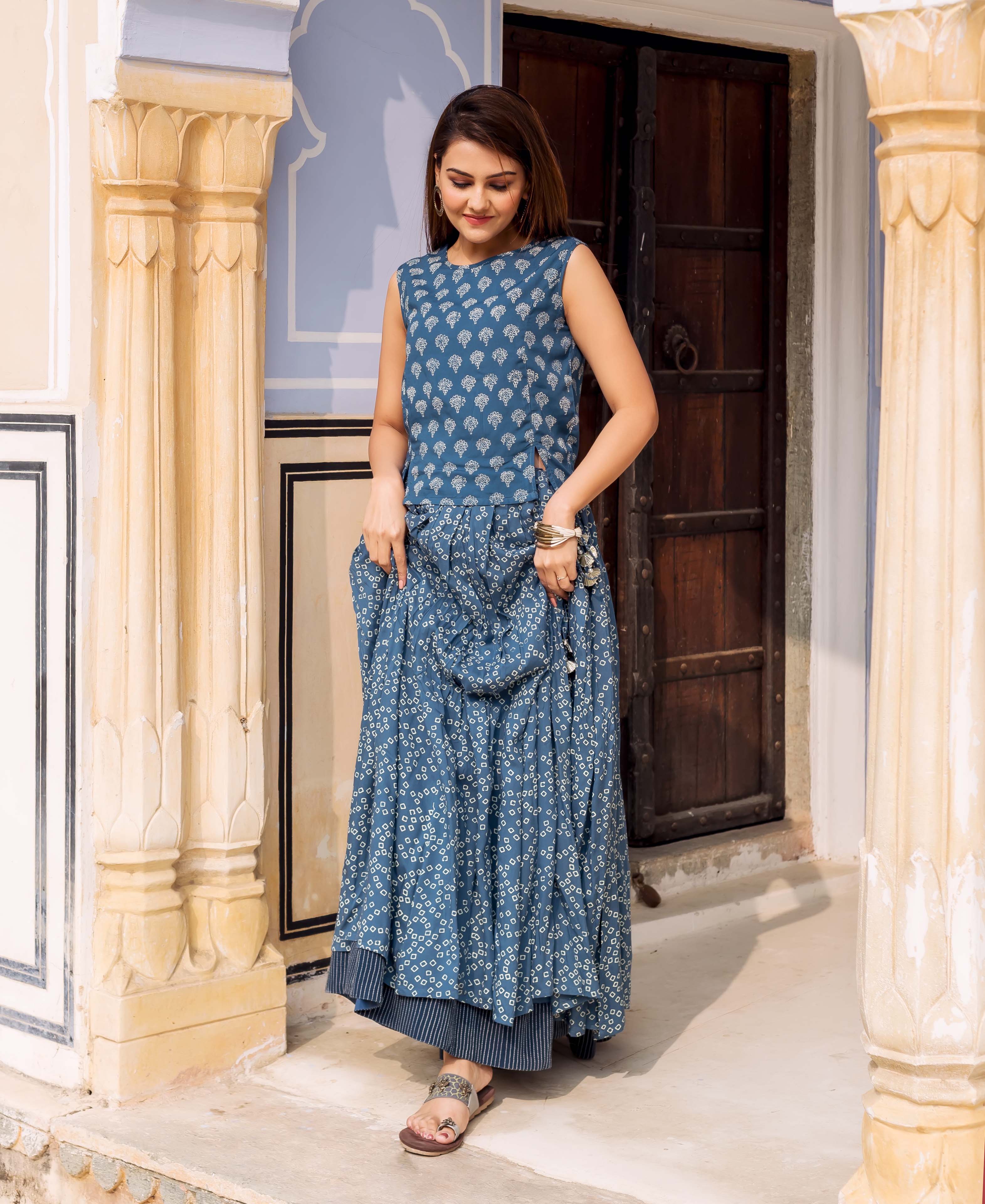 Front full look: model in an indigo hand-block-printed sleeveless top and matching skirt.
