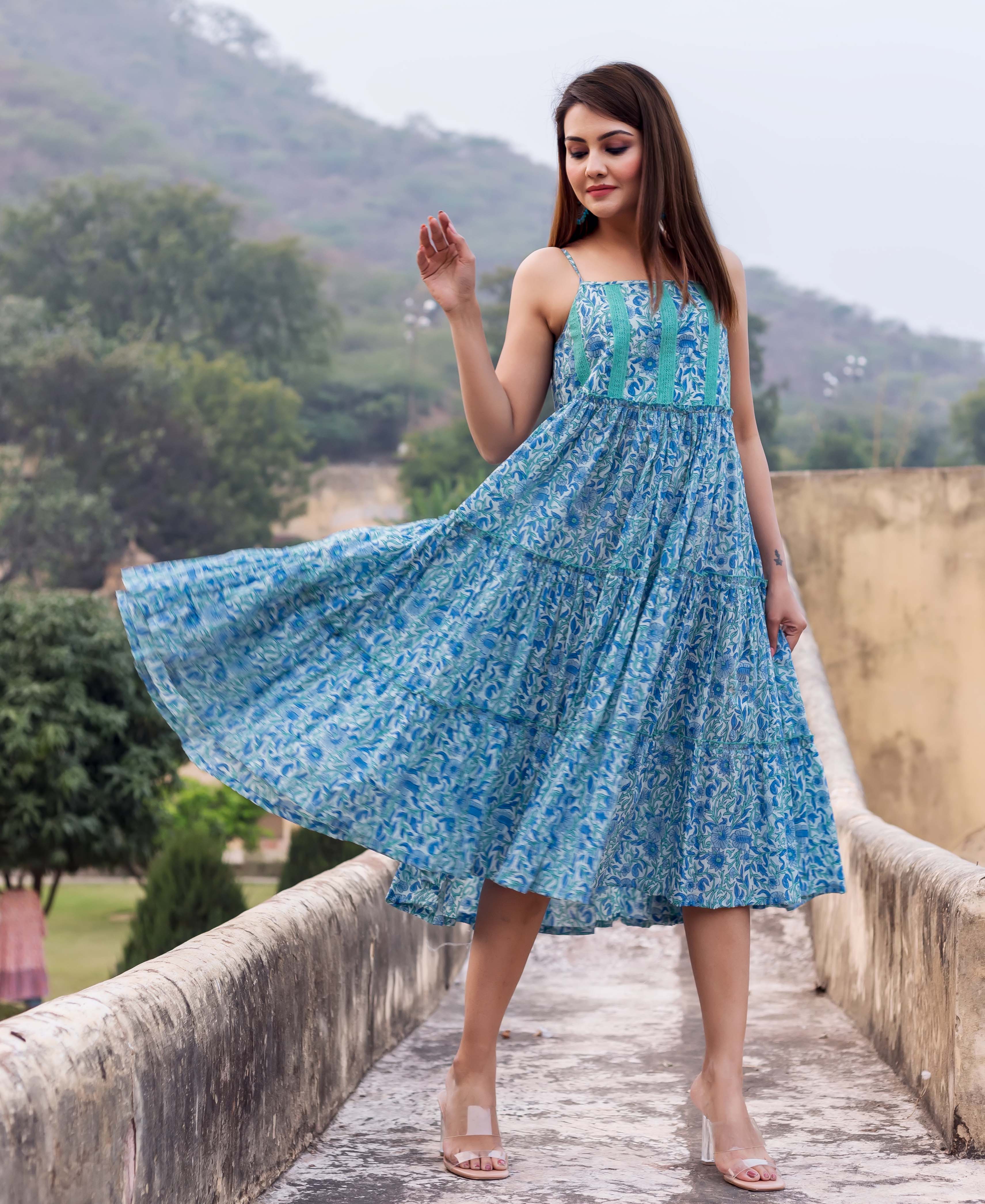 Model wears a flowing Maya blue and white tiered hand-block printed sundress.