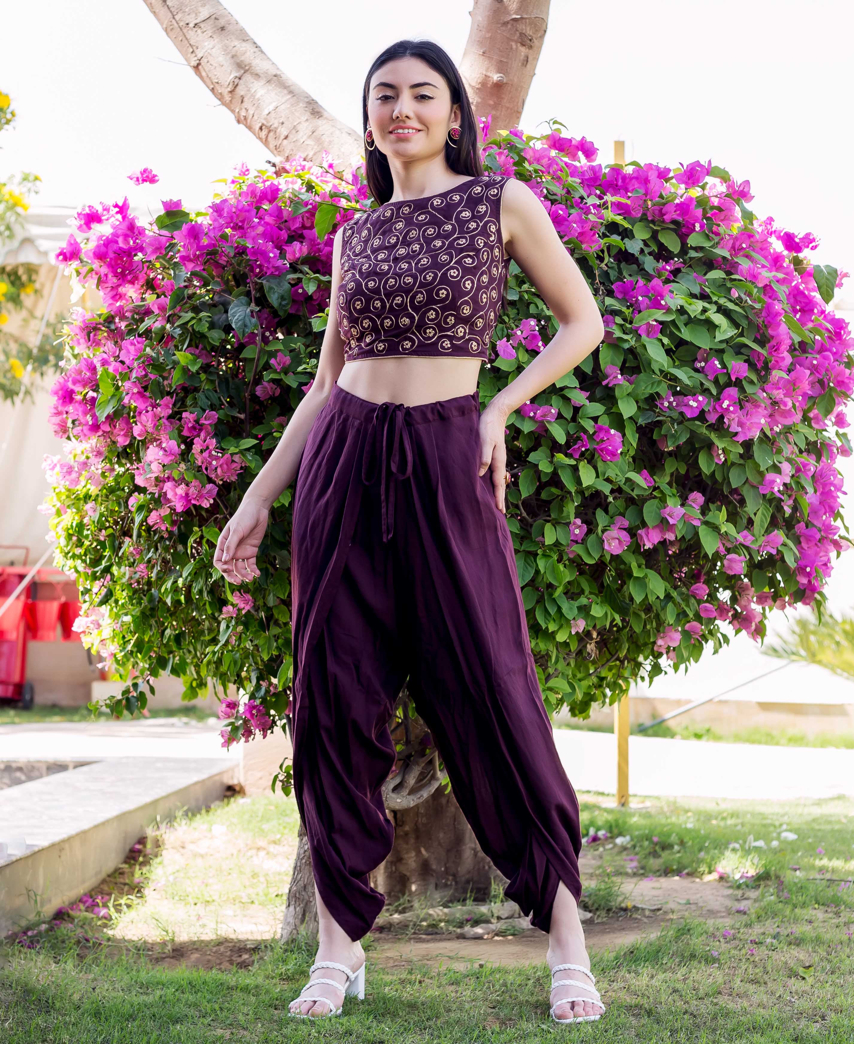 Full-body model in wine dori embroidered crop top and matching drawstring dhoti pants.