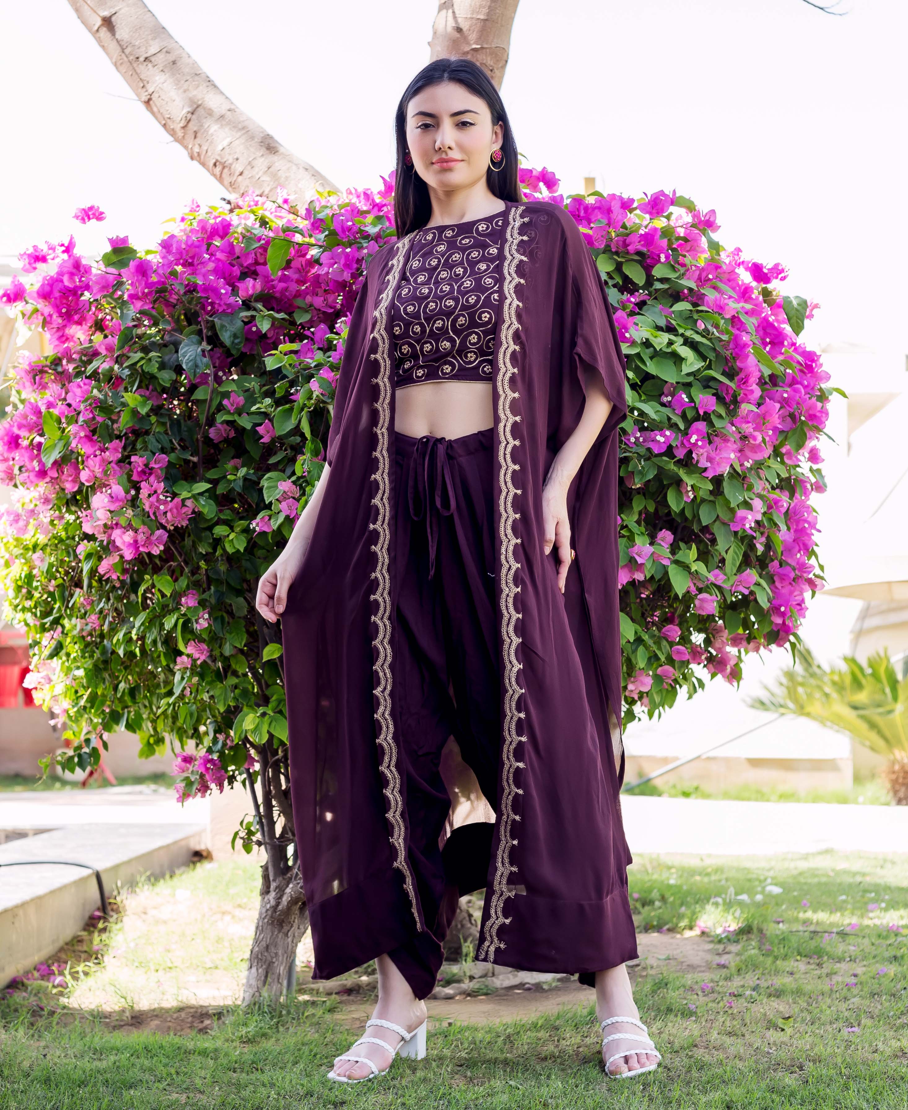 Model in full-length wine Dori embroidered crop top, dhoti pants, and long jacket.