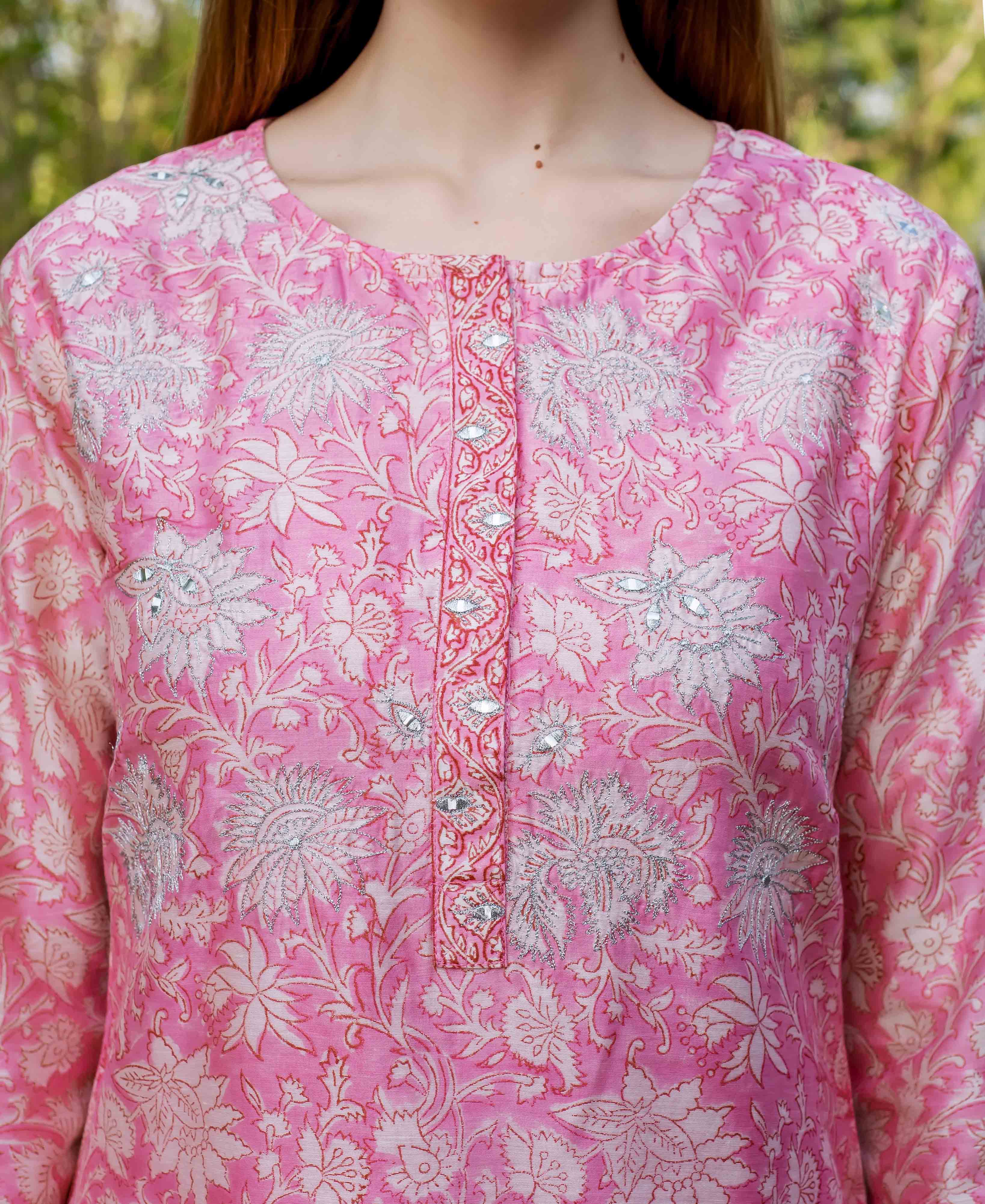 Pink hand block printed floral kurta on model, with silver embroidery and mirror accents.