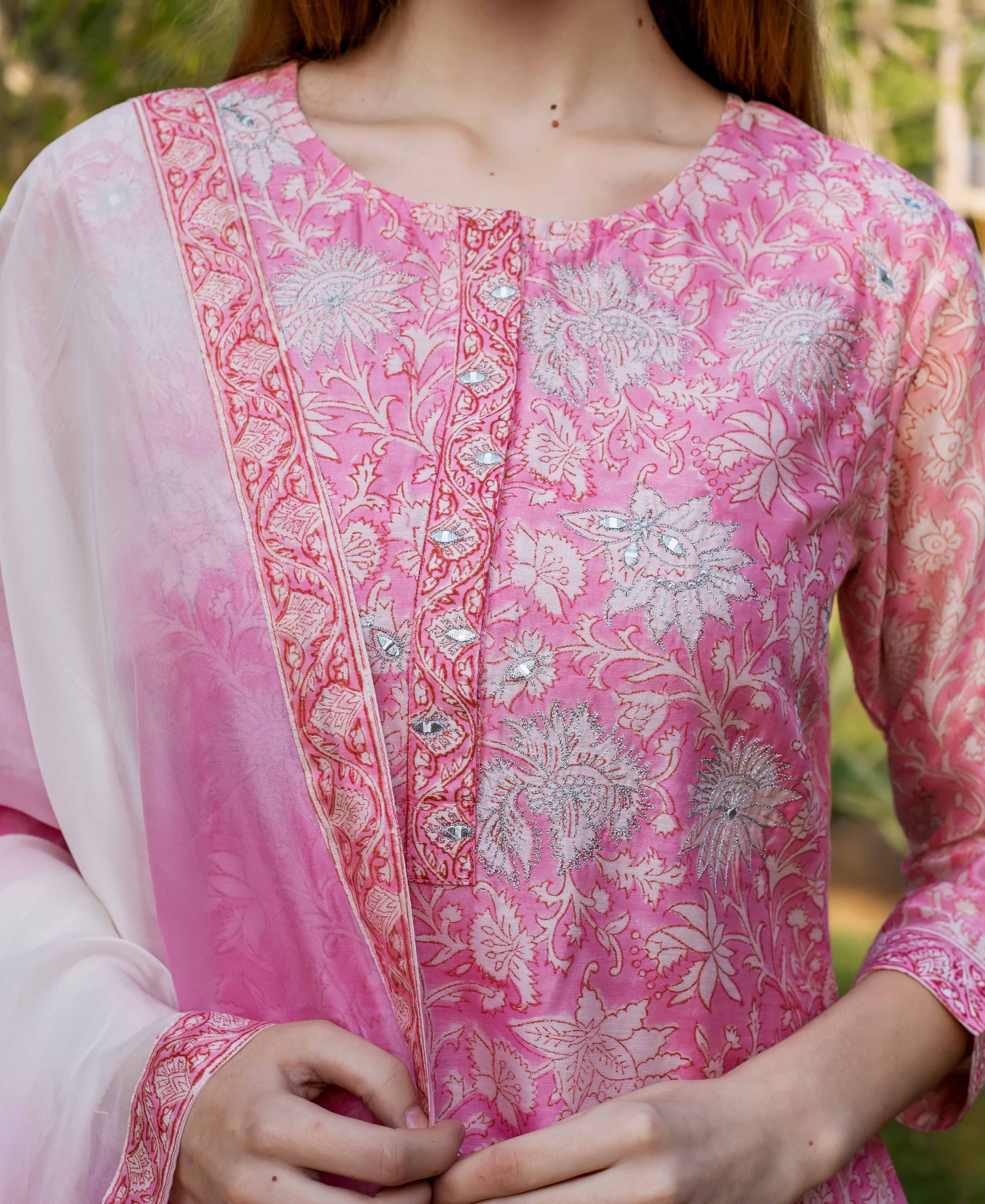 Pink kurta with white floral patterned hand block print and silver embroidery details visible.