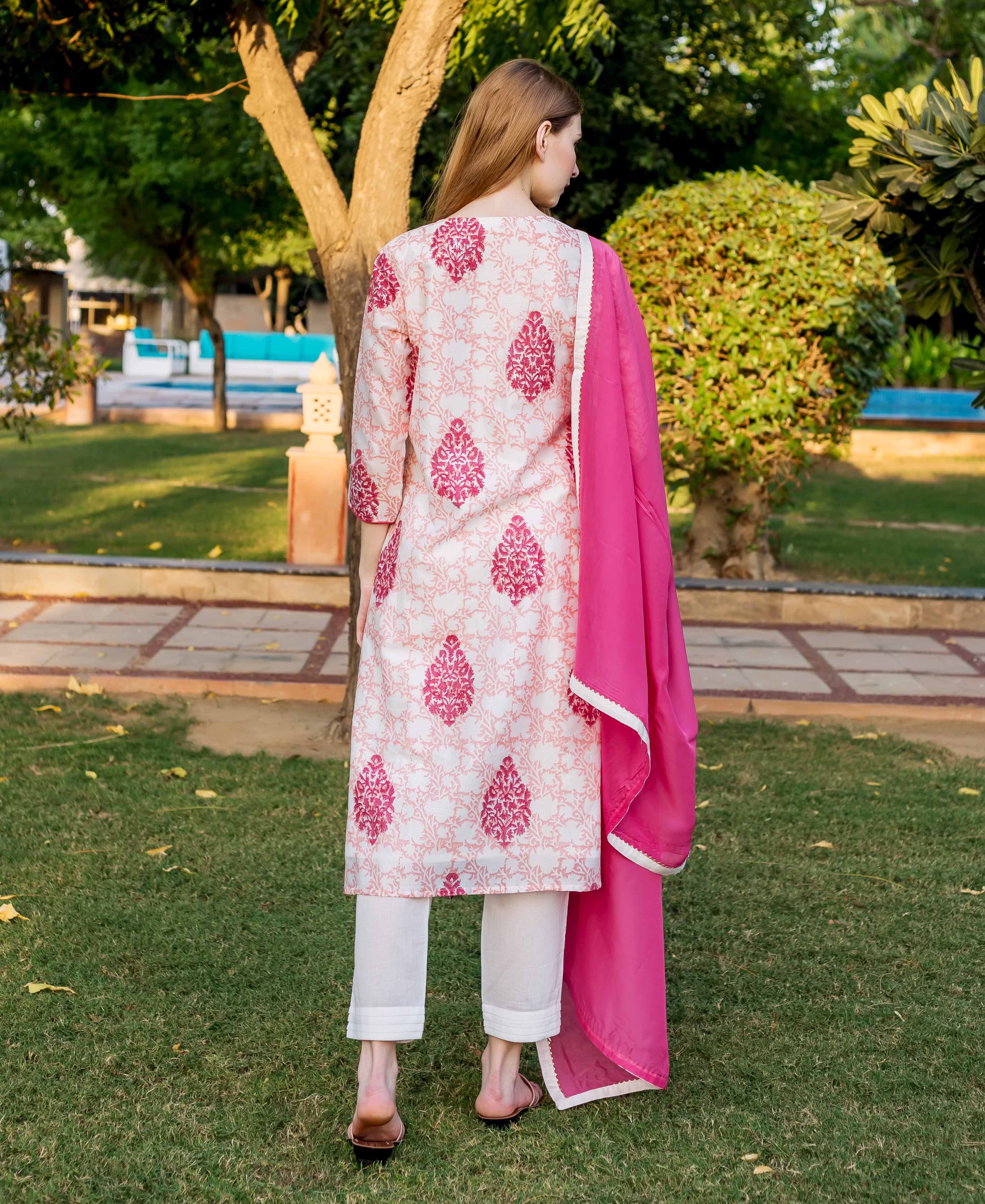 A model wearing a peach and pink block-printed kurta with a pink dupatta.