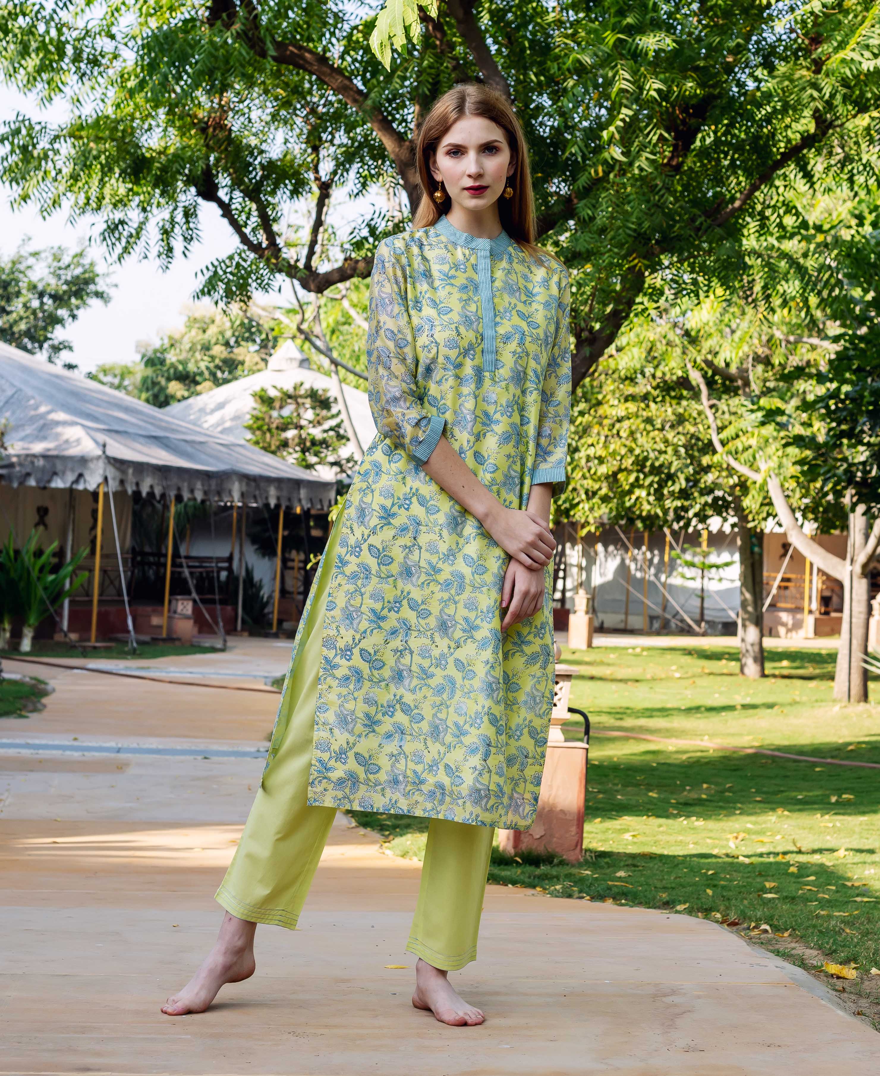 Full front view of a model in a lime green floral hand-block printed straight kurta set.