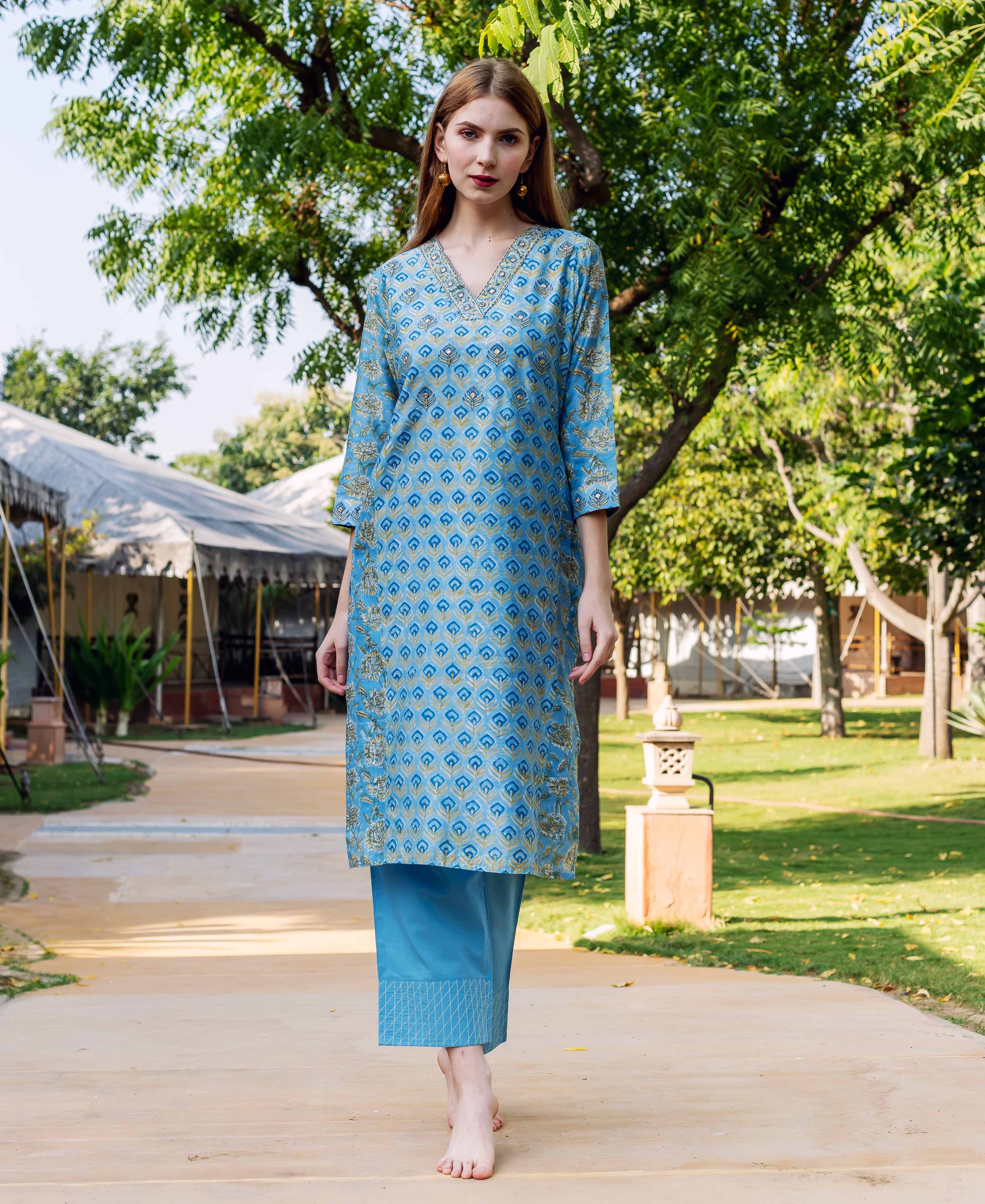 Full-length model in blue hand-block-printed ethnic kurta with matching blue straight pants.