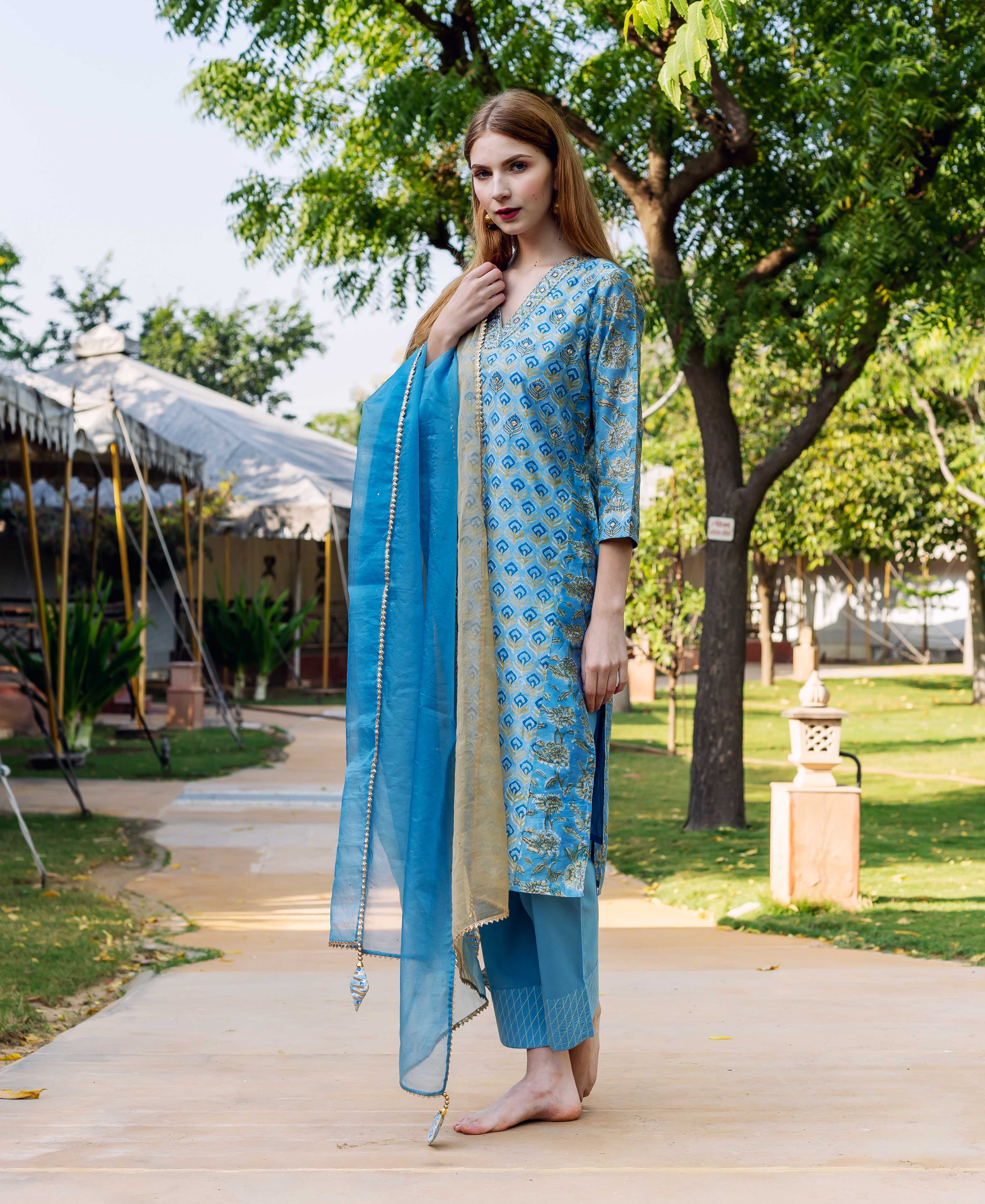 Woman in blue chanderi straight kurta, hand-block print, matching pants, and sheer dupatta.