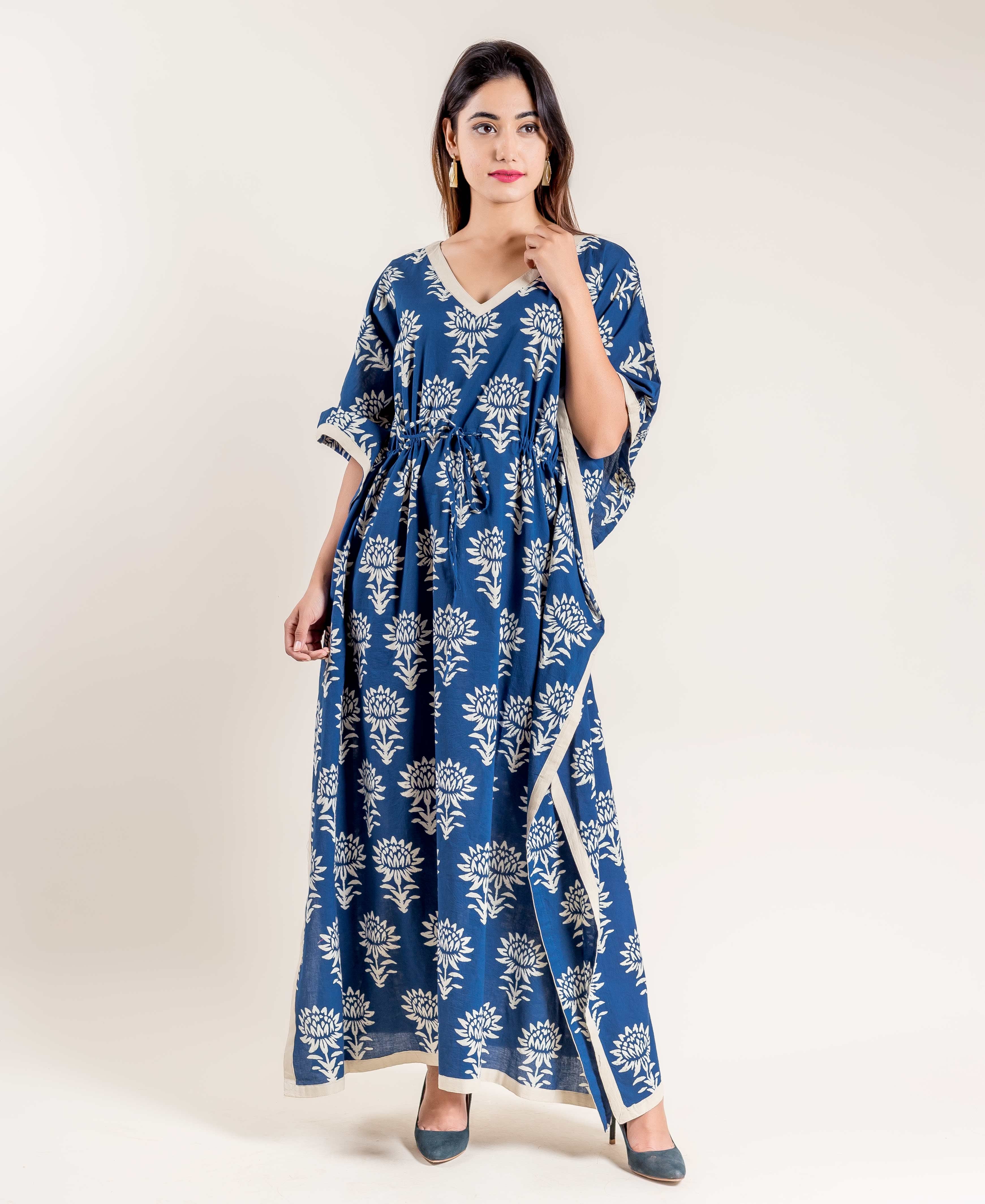 Front view of a model wearing an indigo blue floral hand block printed tie-up kaftan.