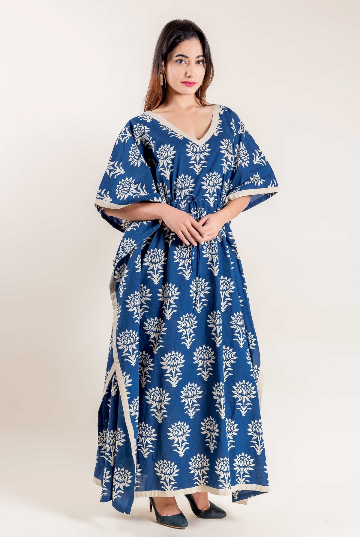 Model in full length indigo blue white floral hand block printed tie-up kaftan.