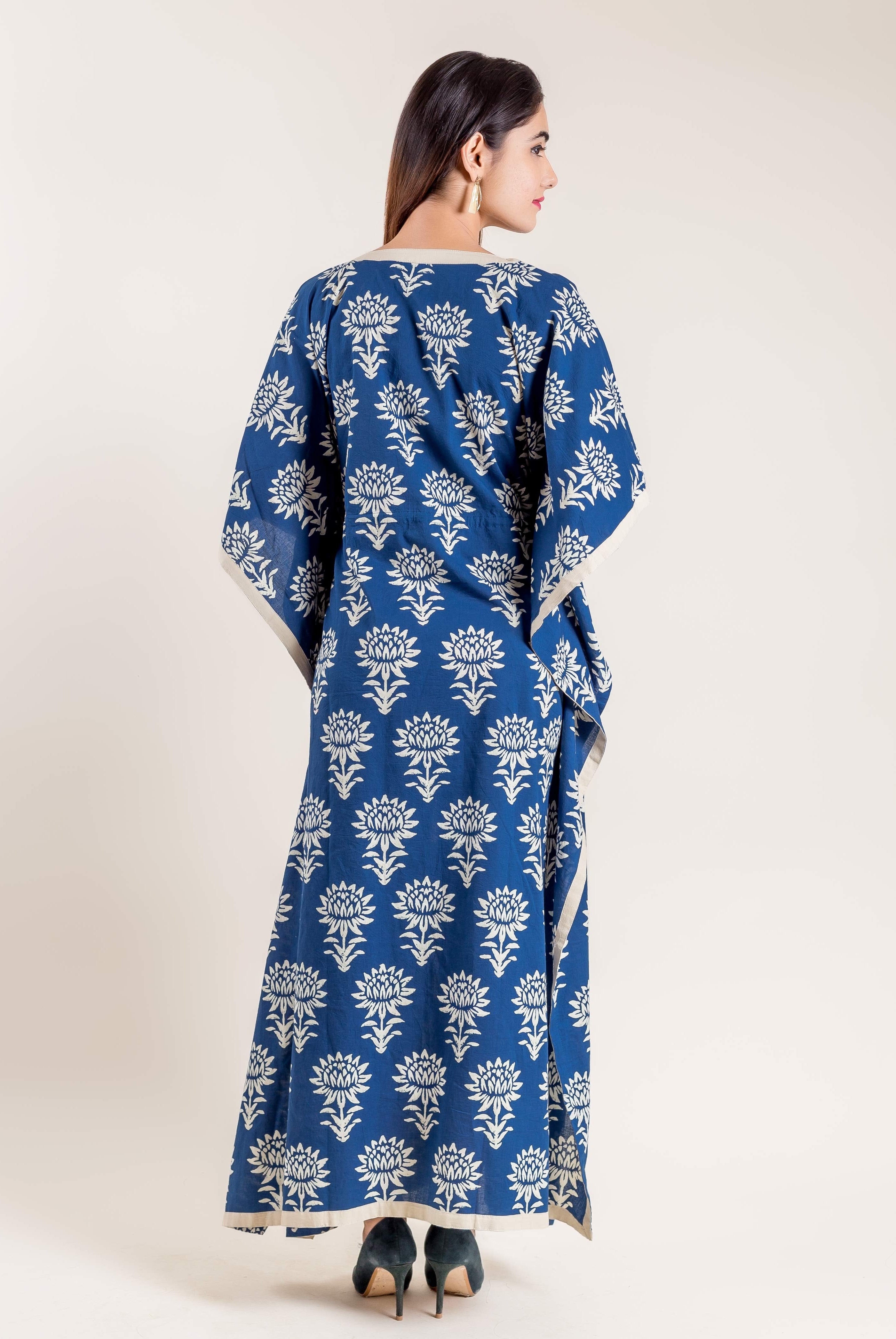 Back view of a model wearing a full-length indigo floral hand block printed kaftan.