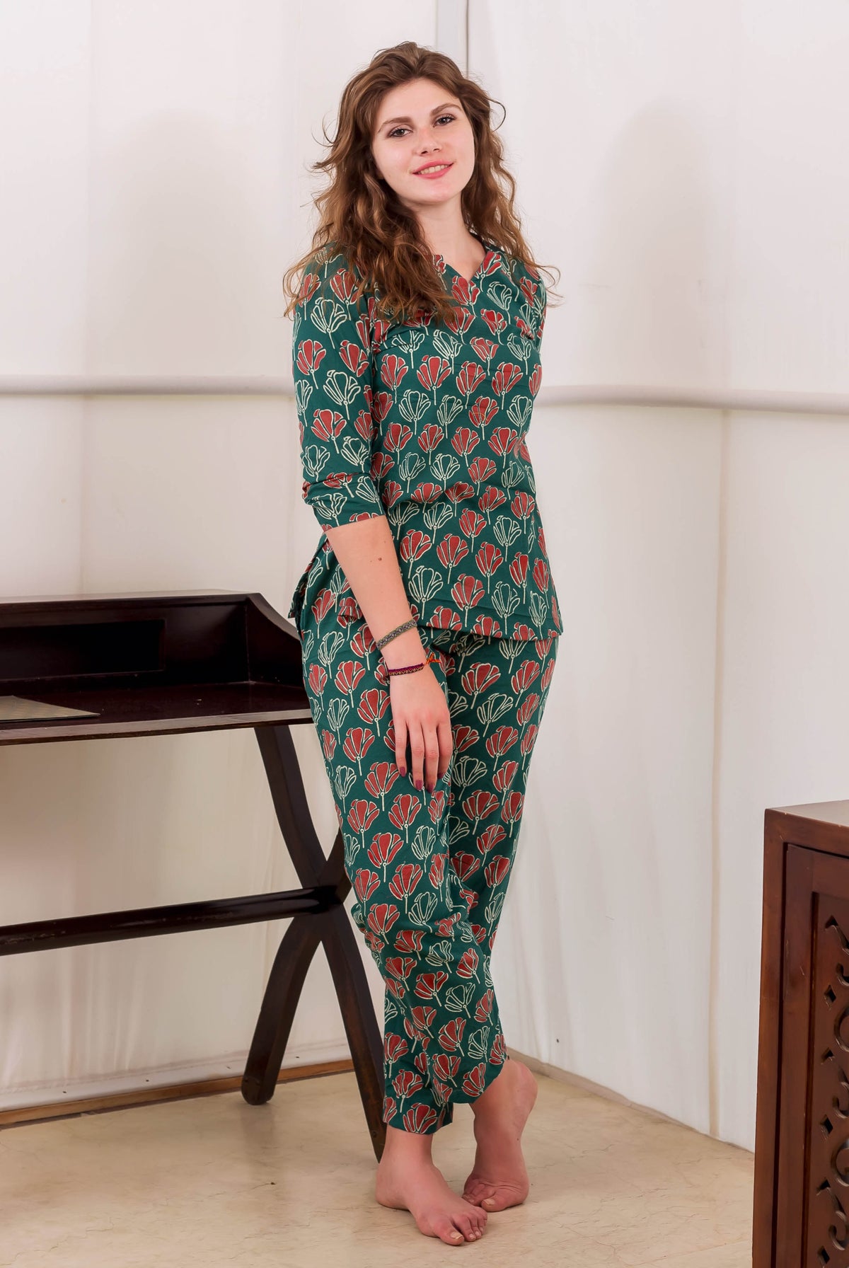 Front full look of model in green and red hand-block printed cotton night suit.