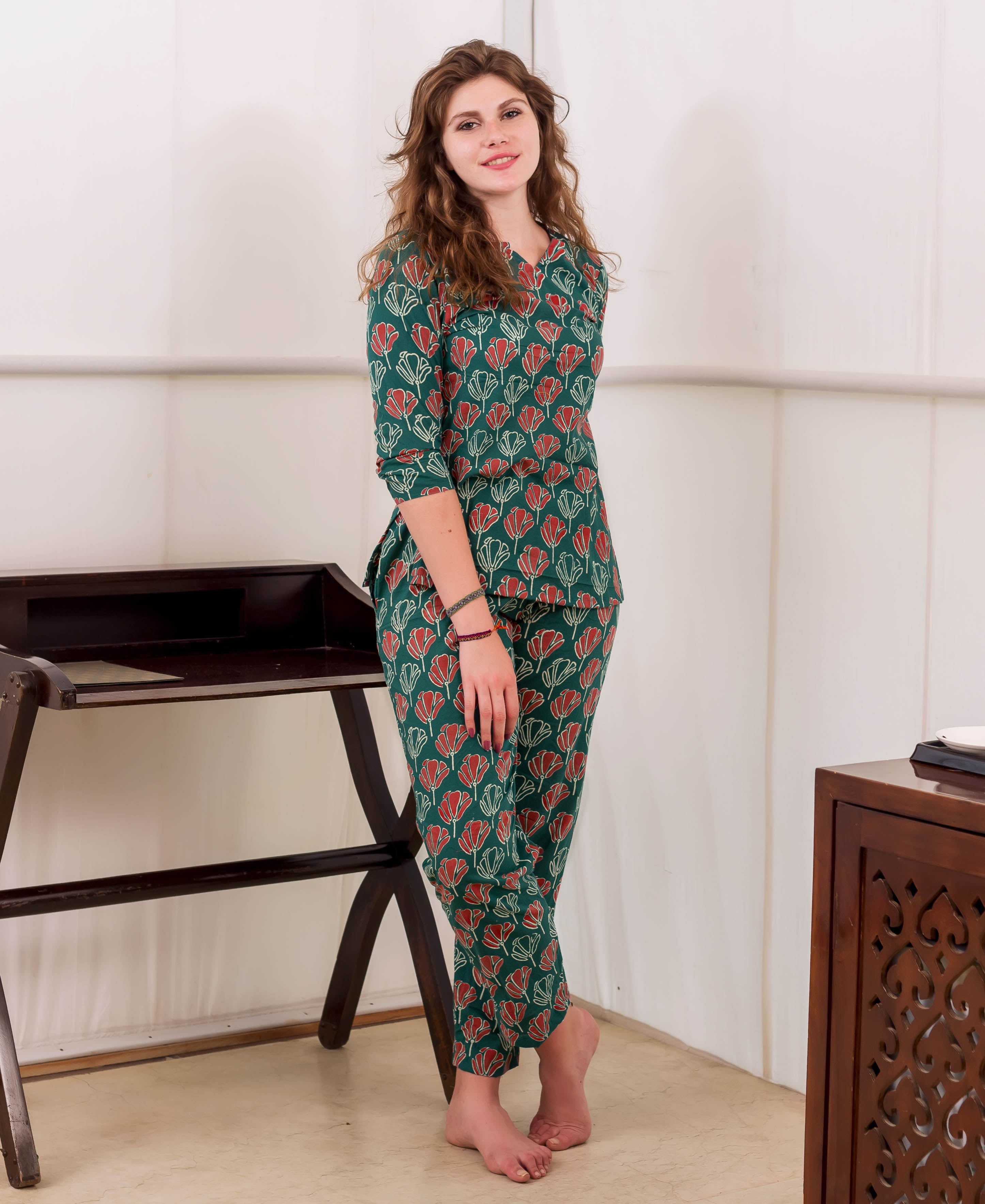 Front full look of model in green and red hand-block printed cotton night suit.