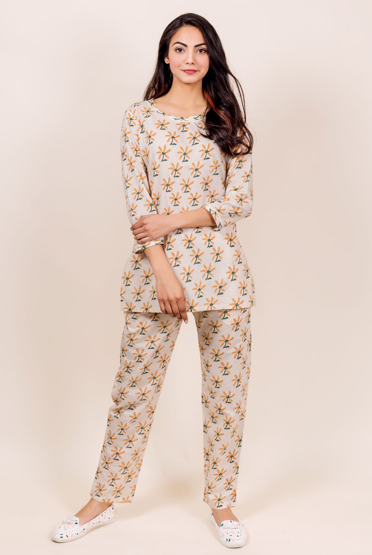 Full shot of model wearing beige MISSPRINT hand-block printed ethnic top and pajama.