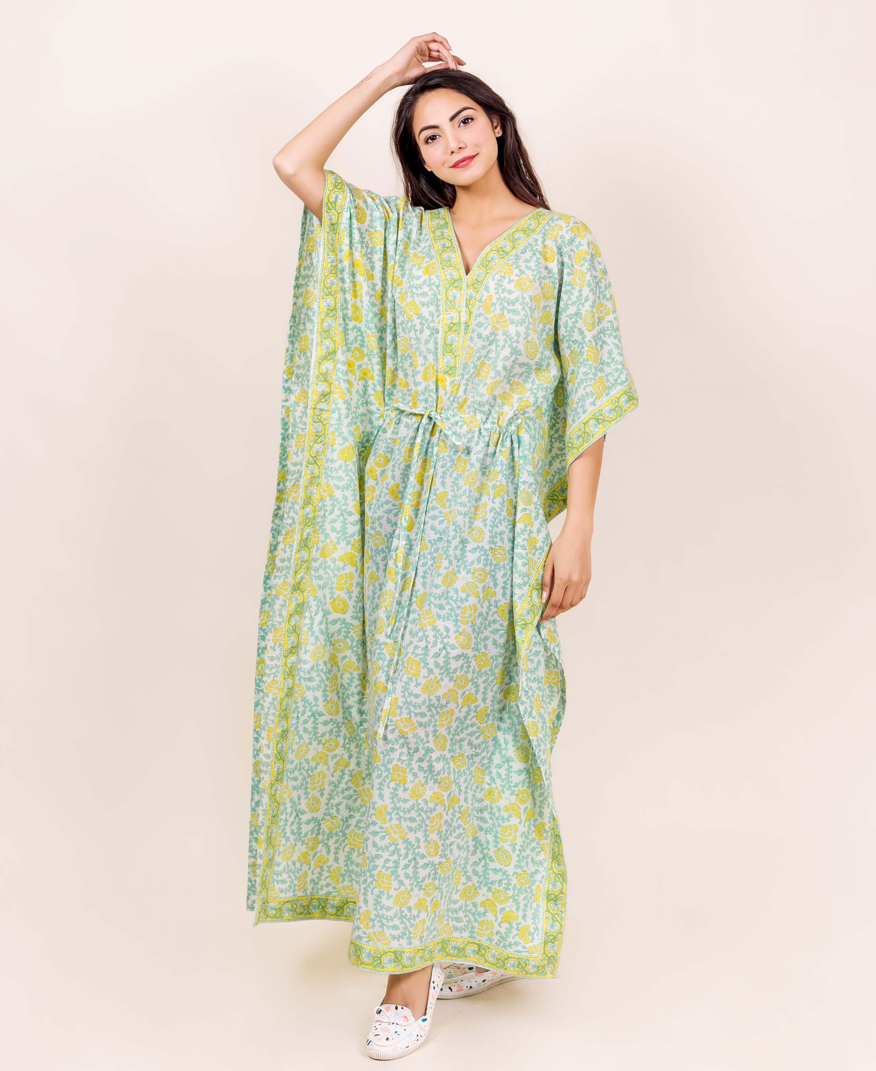 Model in full-length mint green and yellow floral block printed kaftan loungewear.