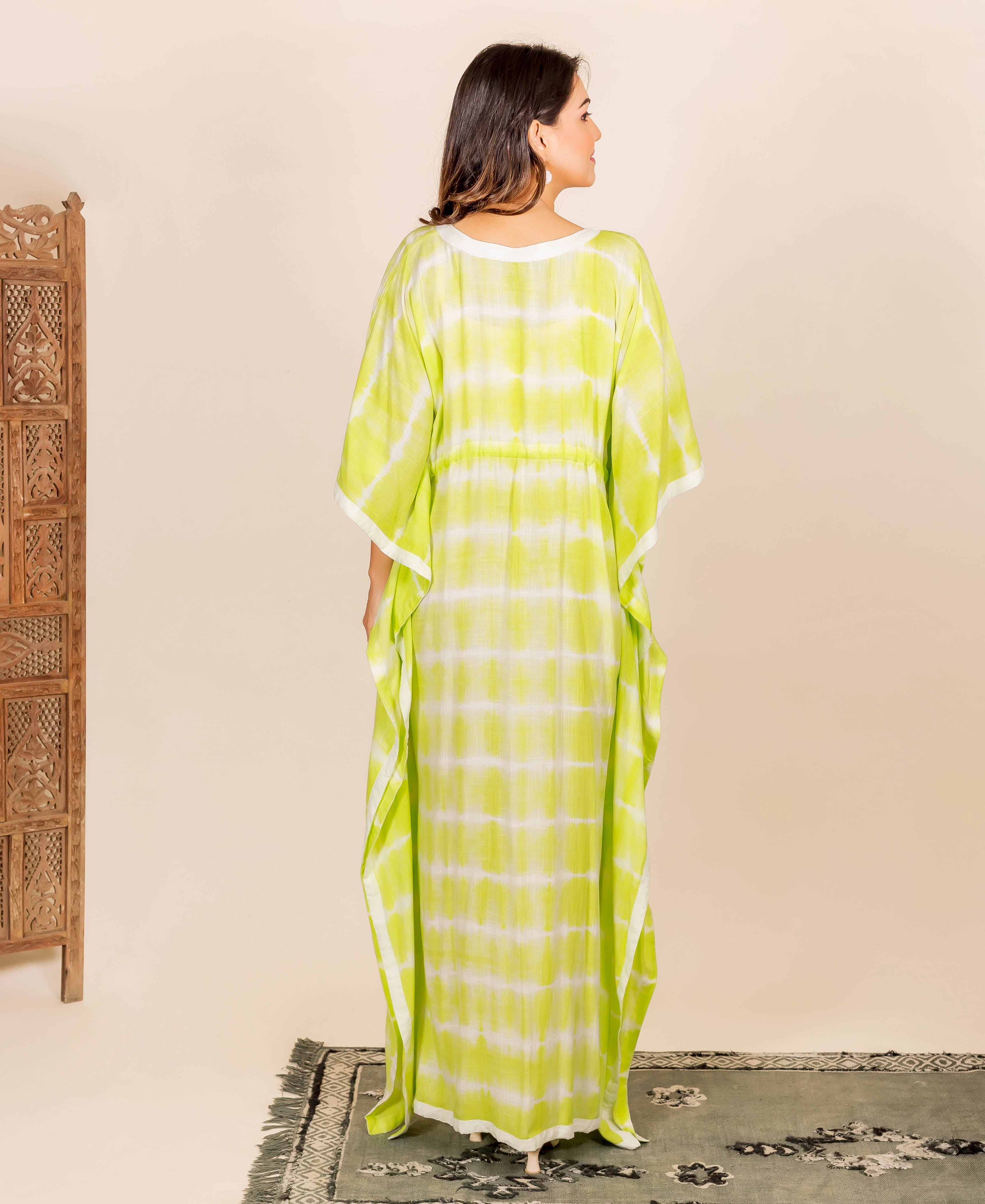 Lime green and white tie-dye kaftan with adjustable waistline and white trim.