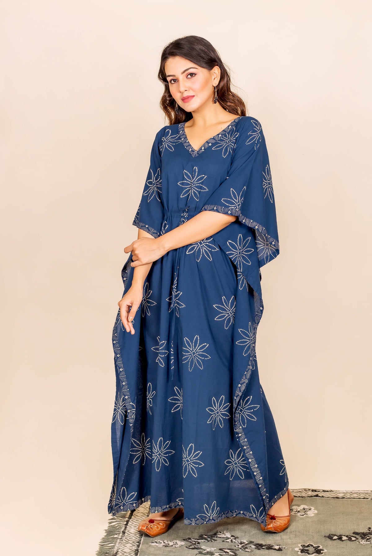 Full-length photo of model in an indigo hand block printed star kaftan.