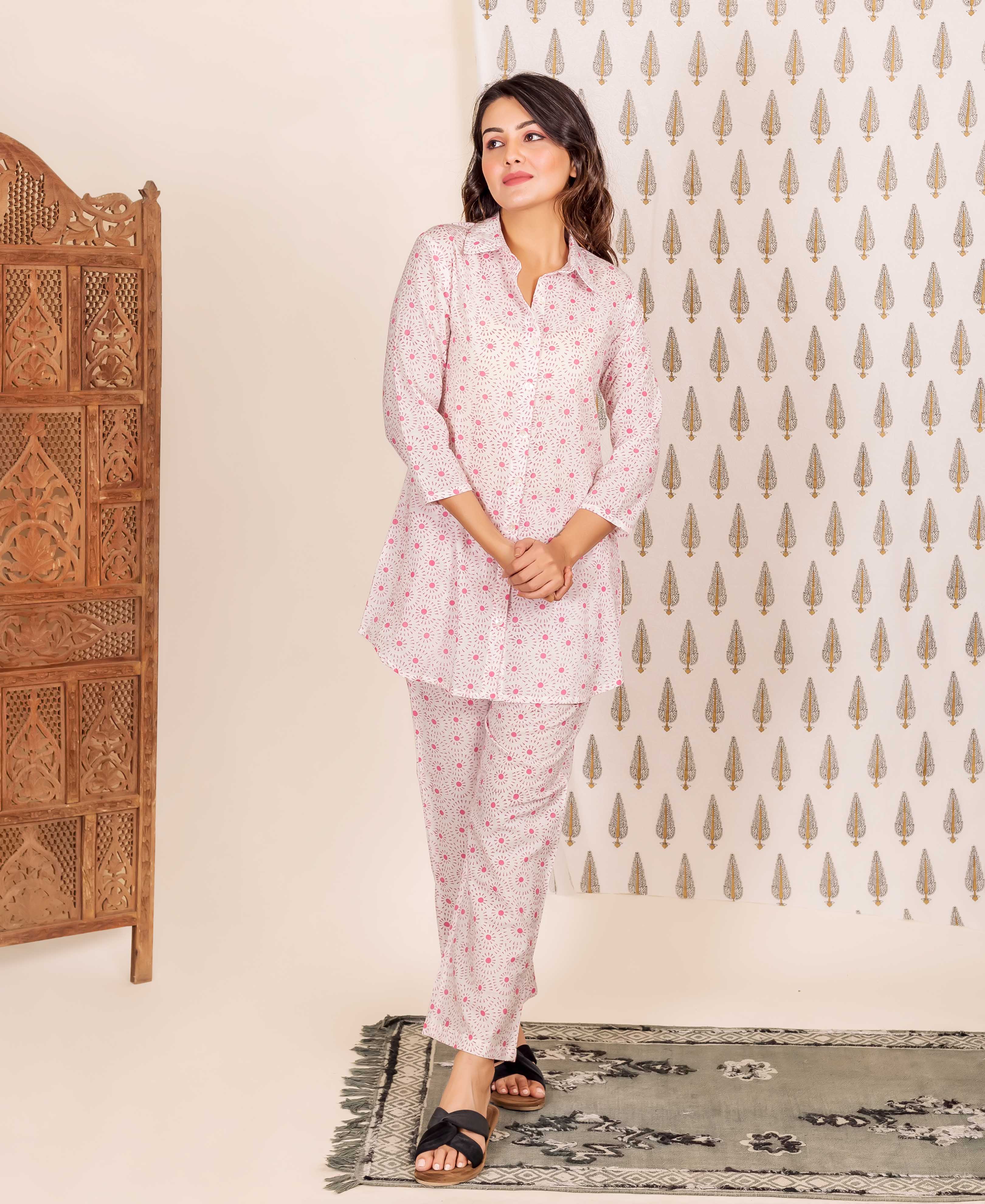 Full shot of model in a Missprint hand-block-printed pink shirt style pajama set.