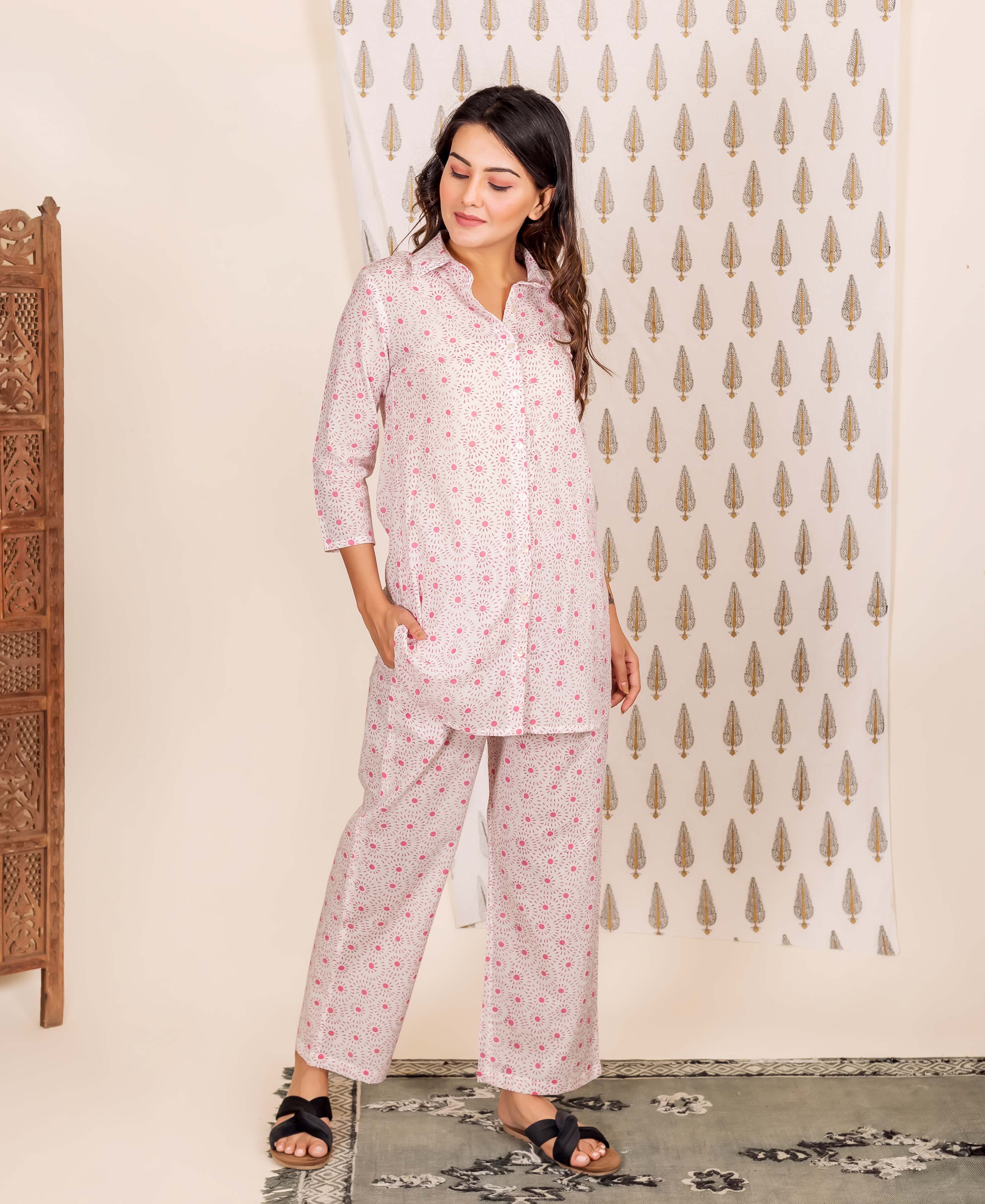 Full-length model wears a pink hand-block-printed shirt style pajama set.