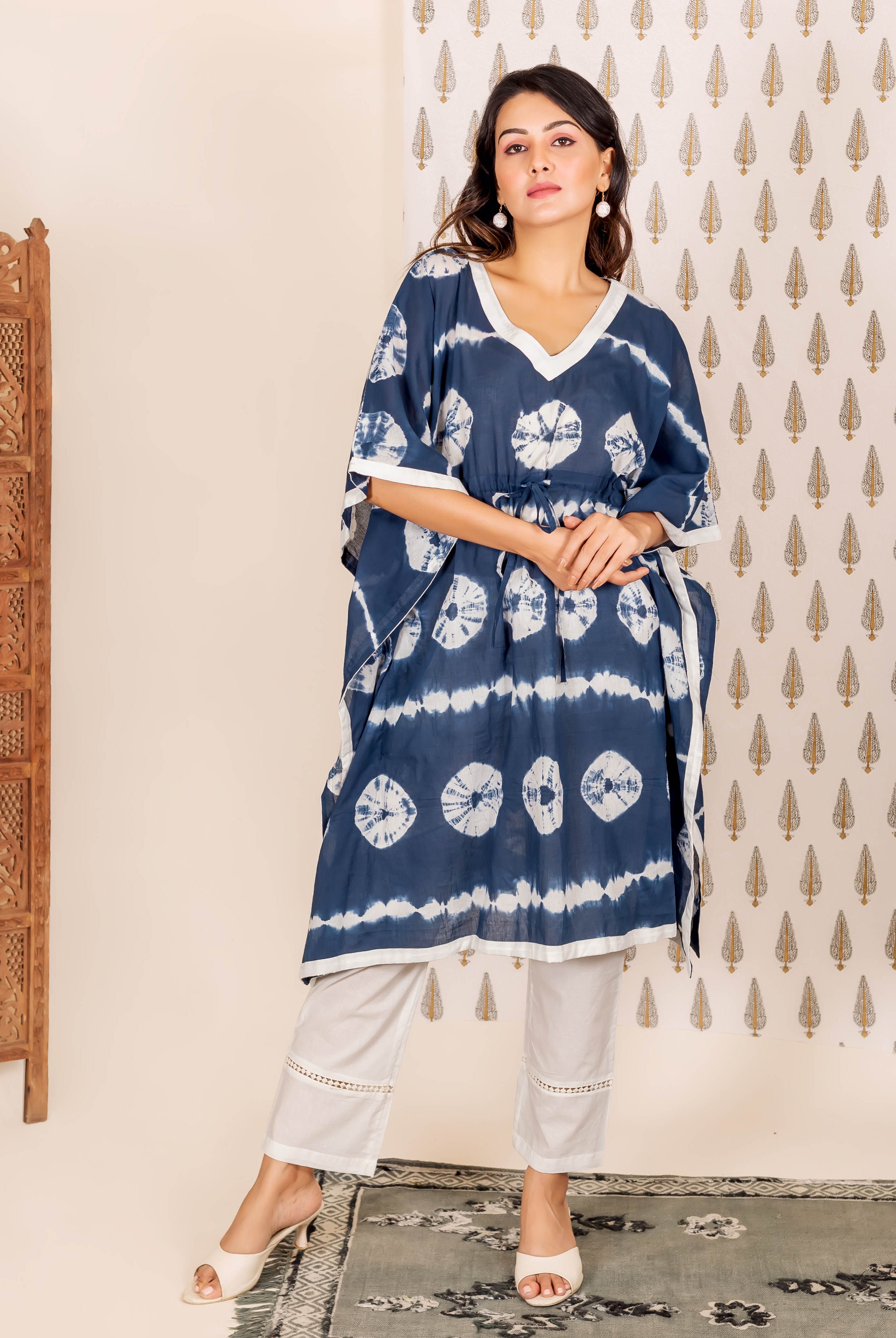 Front view model in navy blue tie-dye kaftan and light grey lace-trim cropped pants.