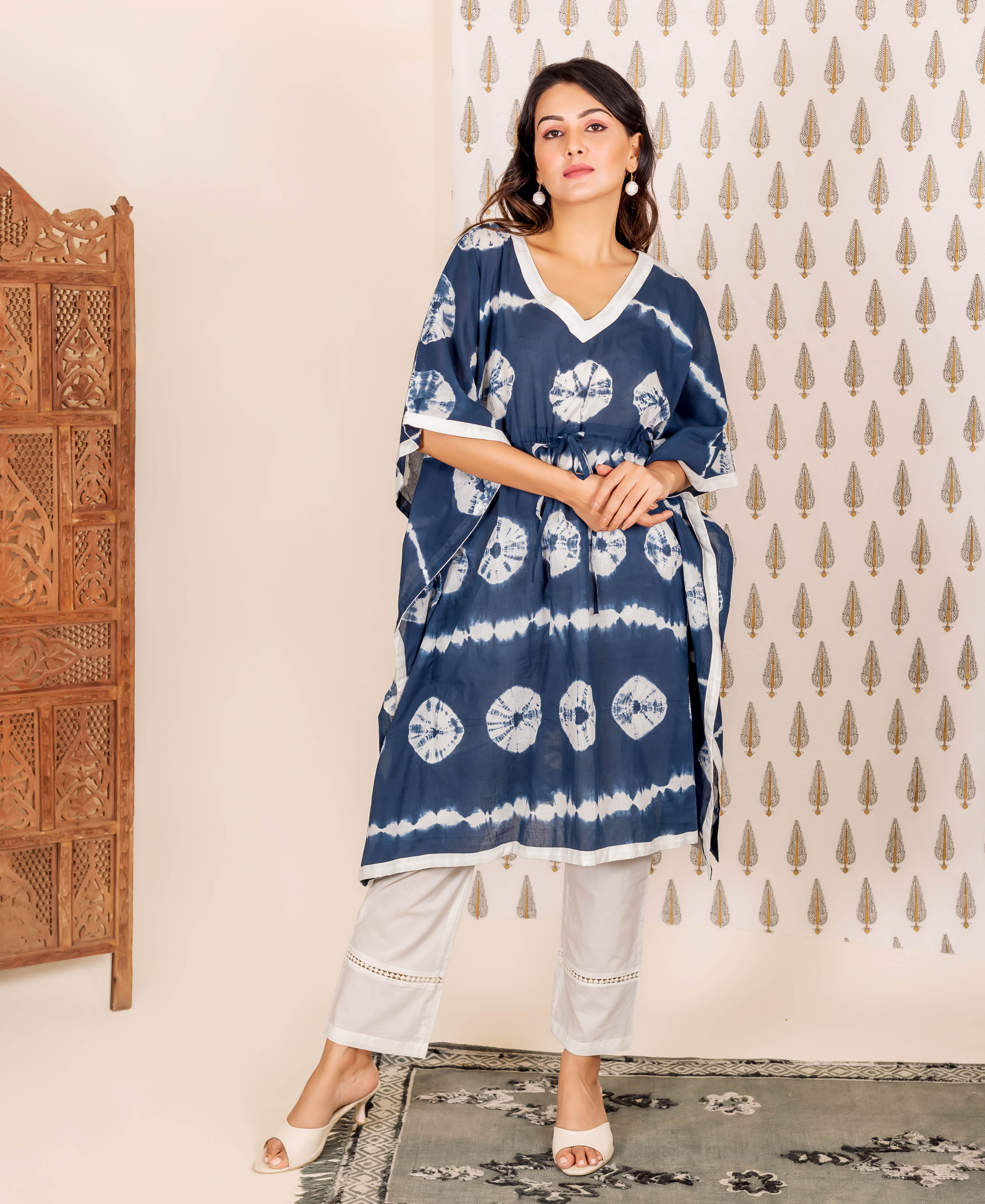 Front view model in navy blue tie-dye kaftan and light grey lace-trim cropped pants.