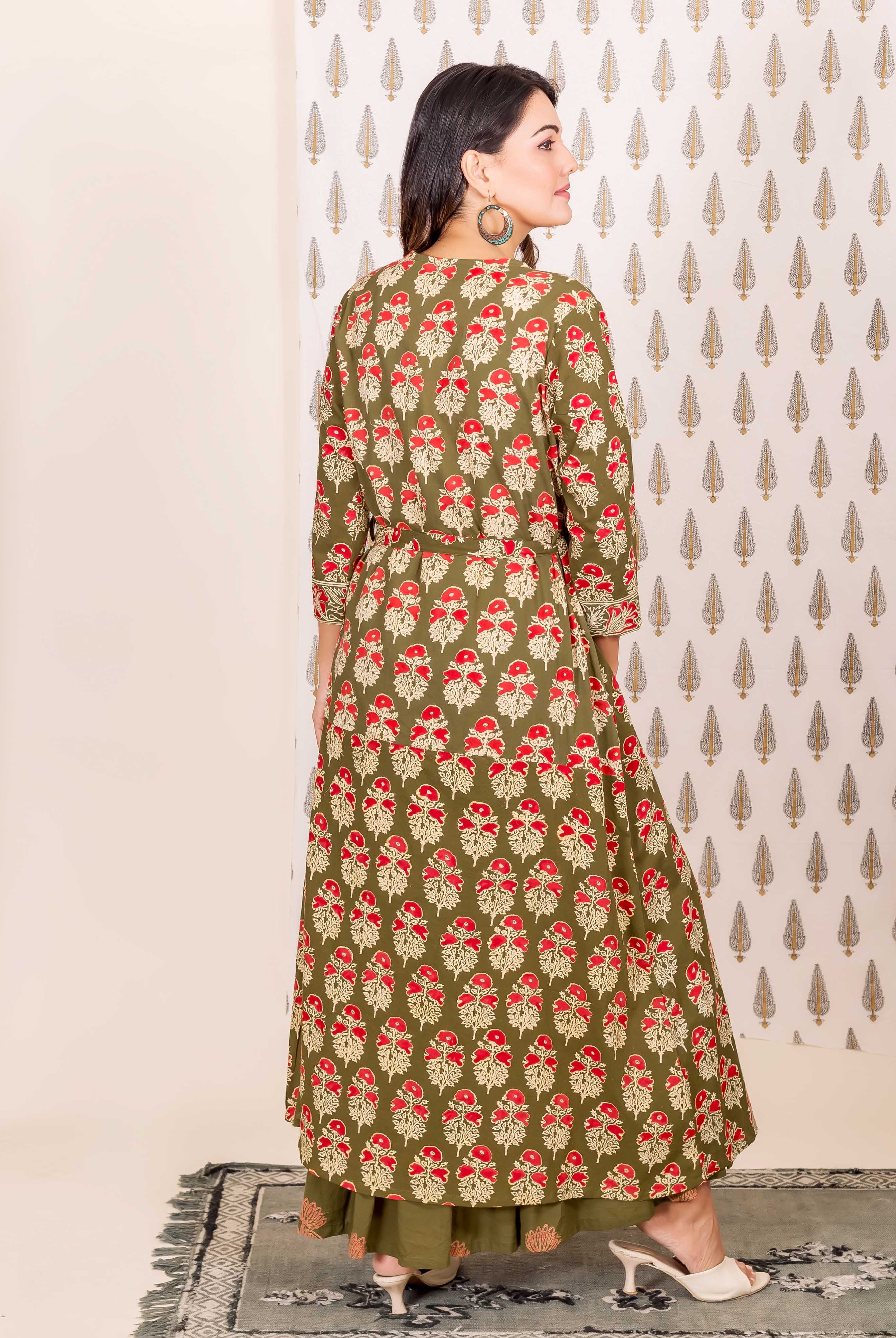 Back view of model in full-length olive green and red hand-block-printed nighty and overlay set.