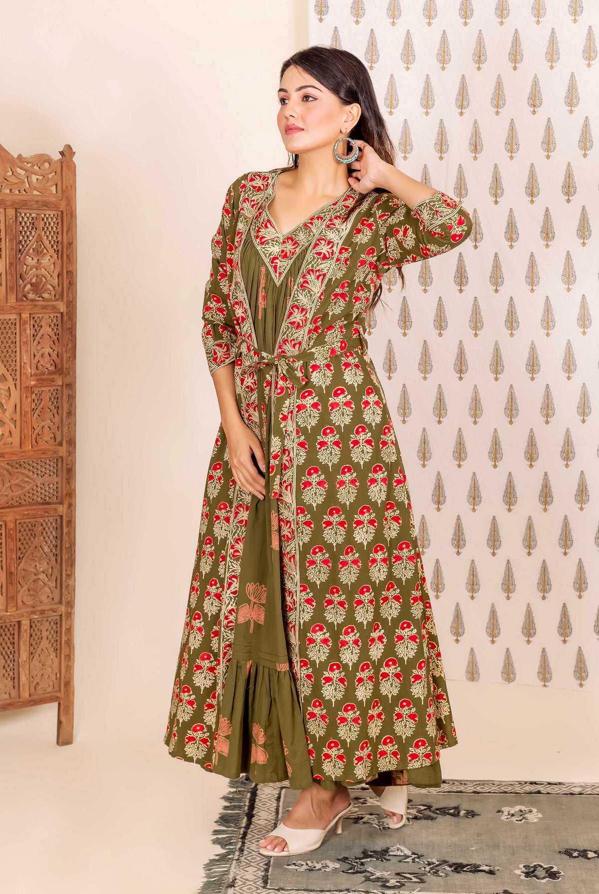 Model in full-length olive green and red hand-block-printed ethnic nighty and overlay set.