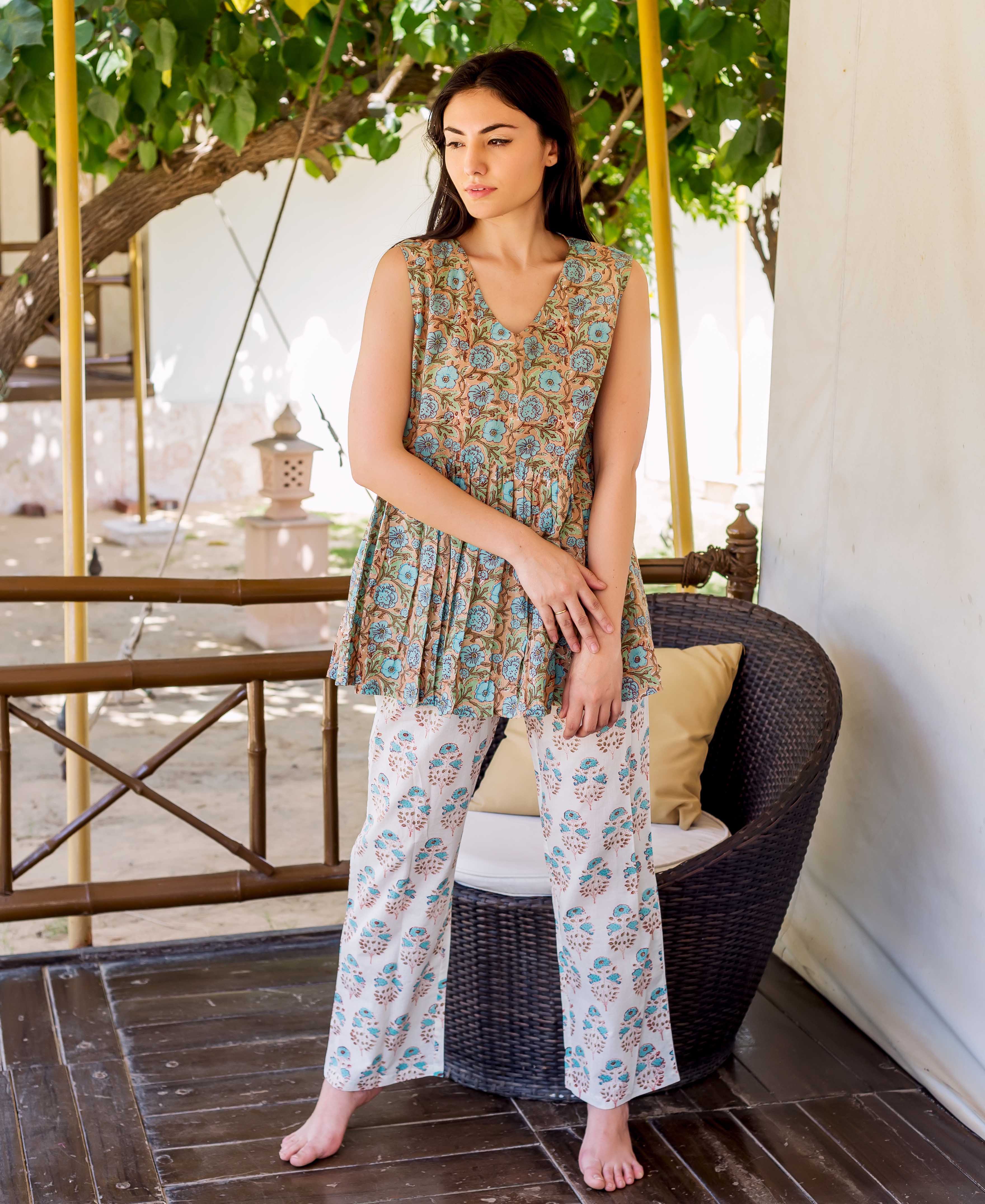 Model in beige floral hand block printed peplum top and white matching lounge pants.
