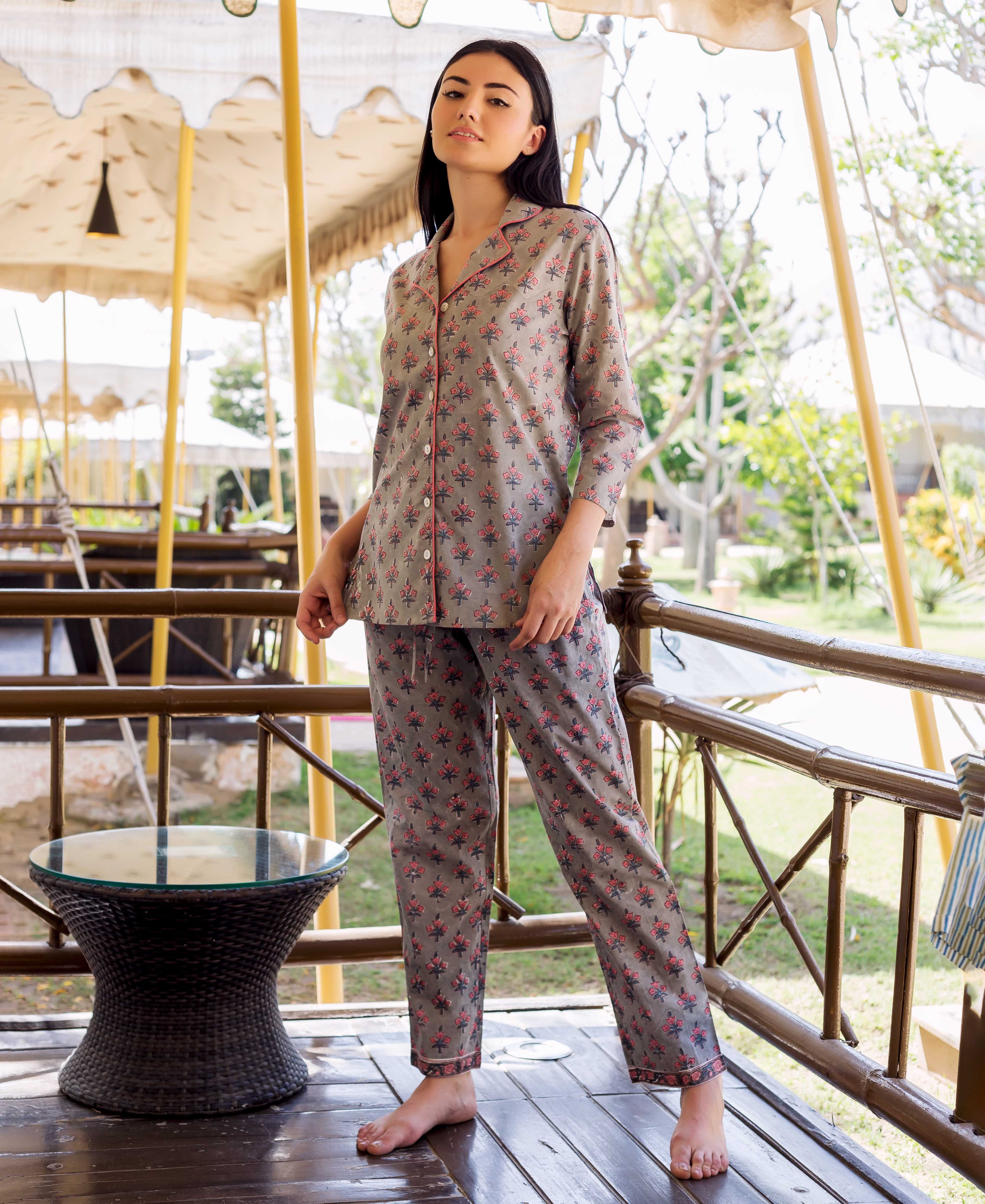 Full front view model wearing grey night suit with pink hand-block-printed ethnic motifs.