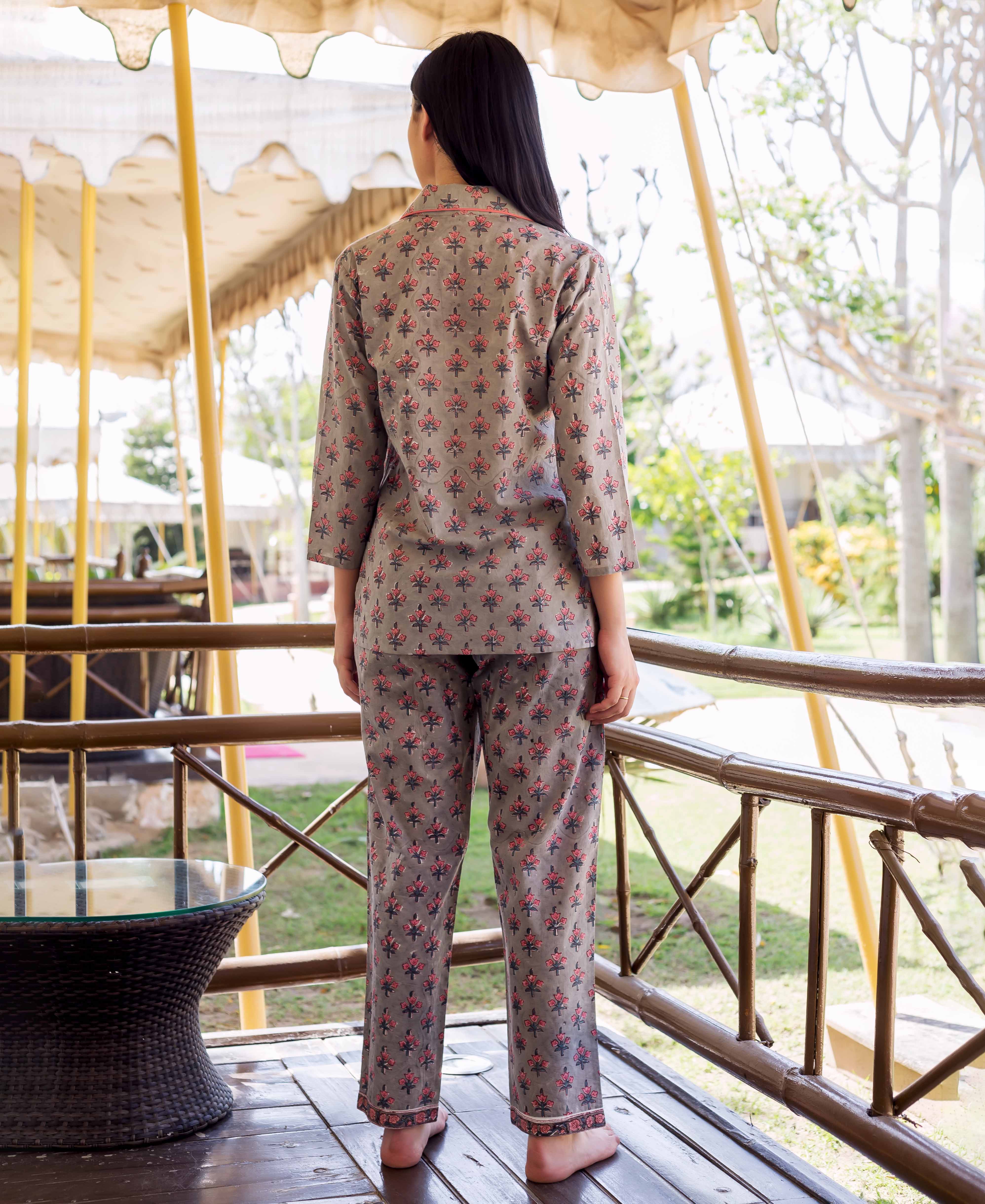 Grey hand-block-printed shirt and pajama night suit with pink floral motifs, back view.