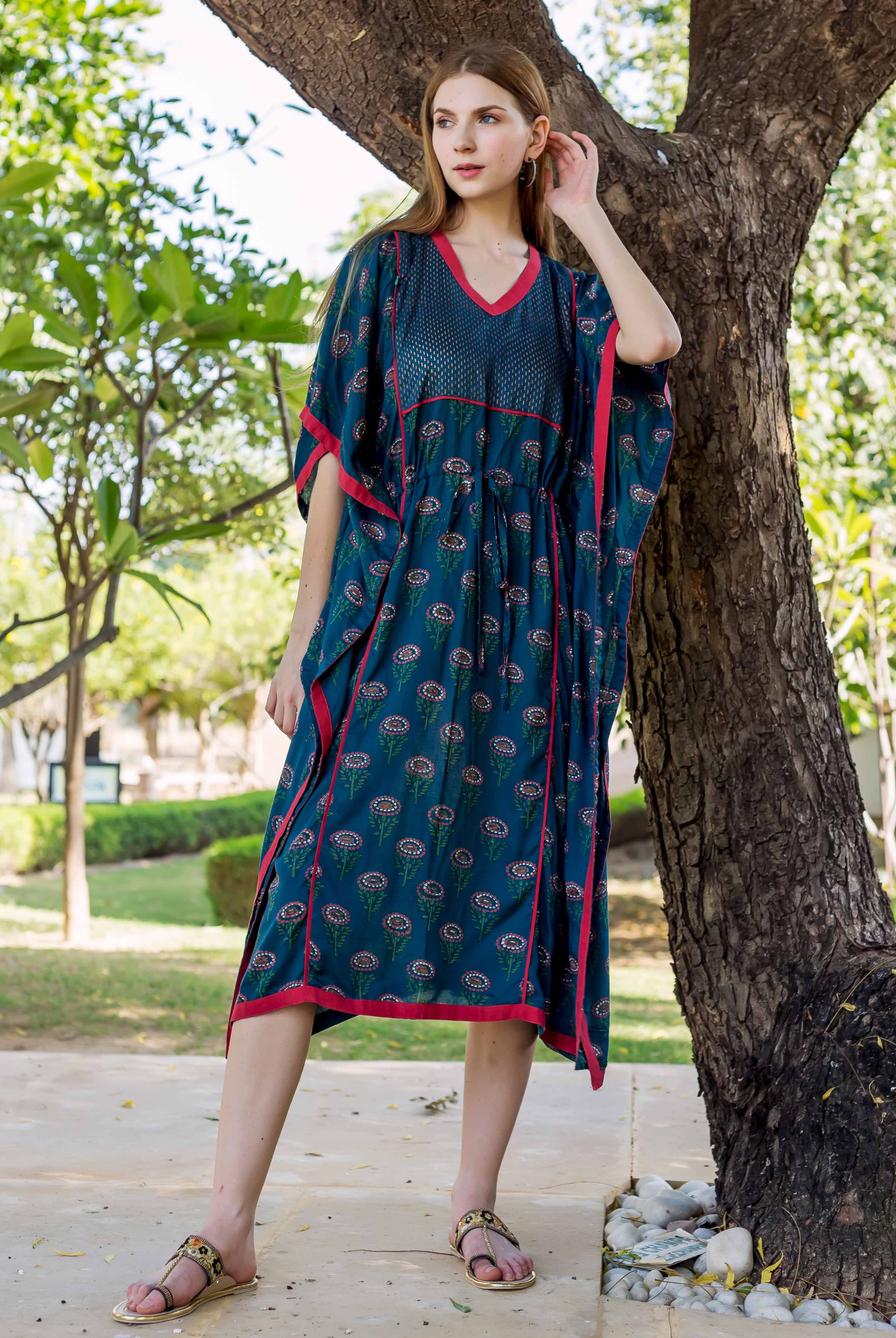 Full-length model wears peacock green hand-block-printed ethnic maternal and nursing kaftan with red trim.