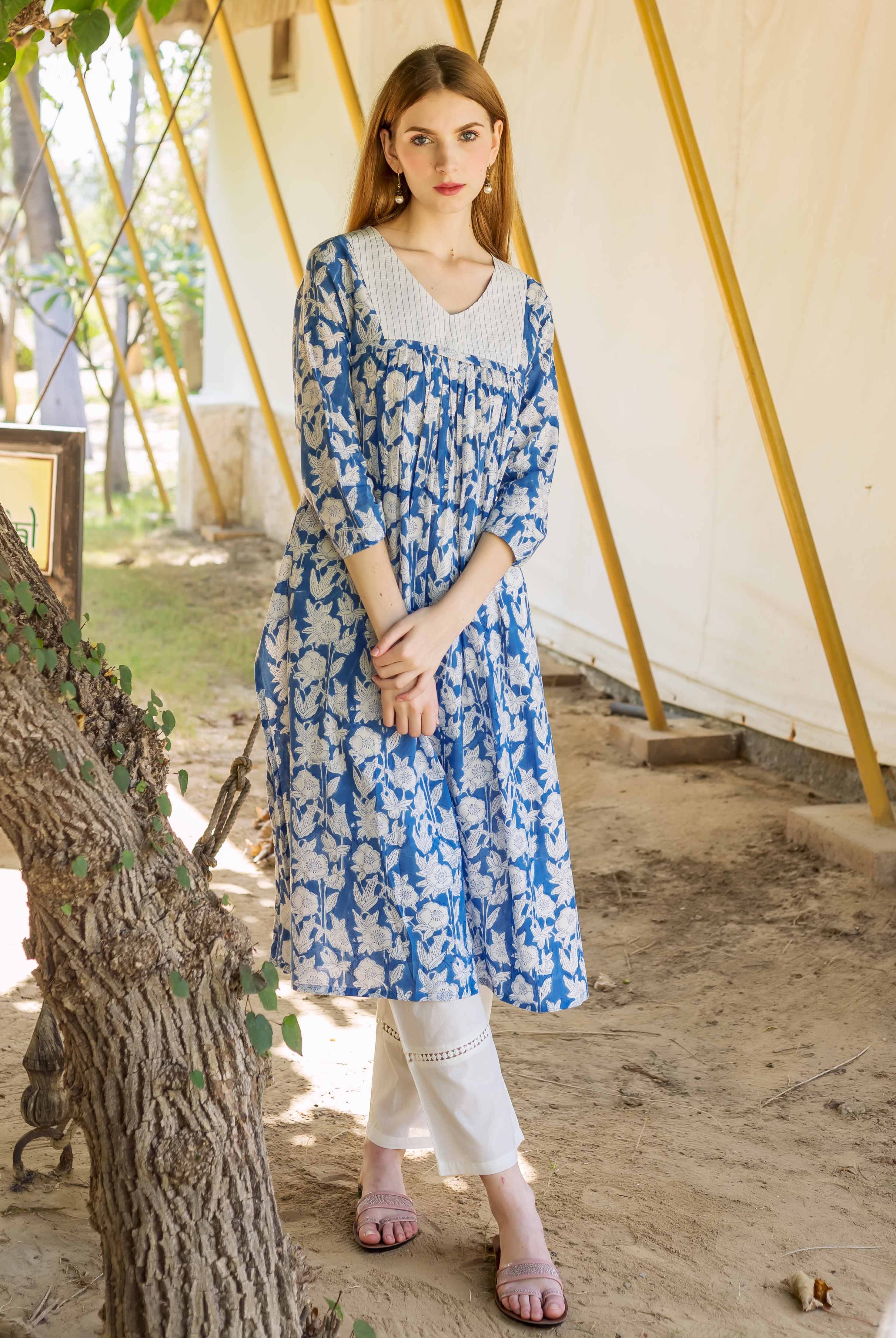 A model wearing a blue and white floral print kurta.