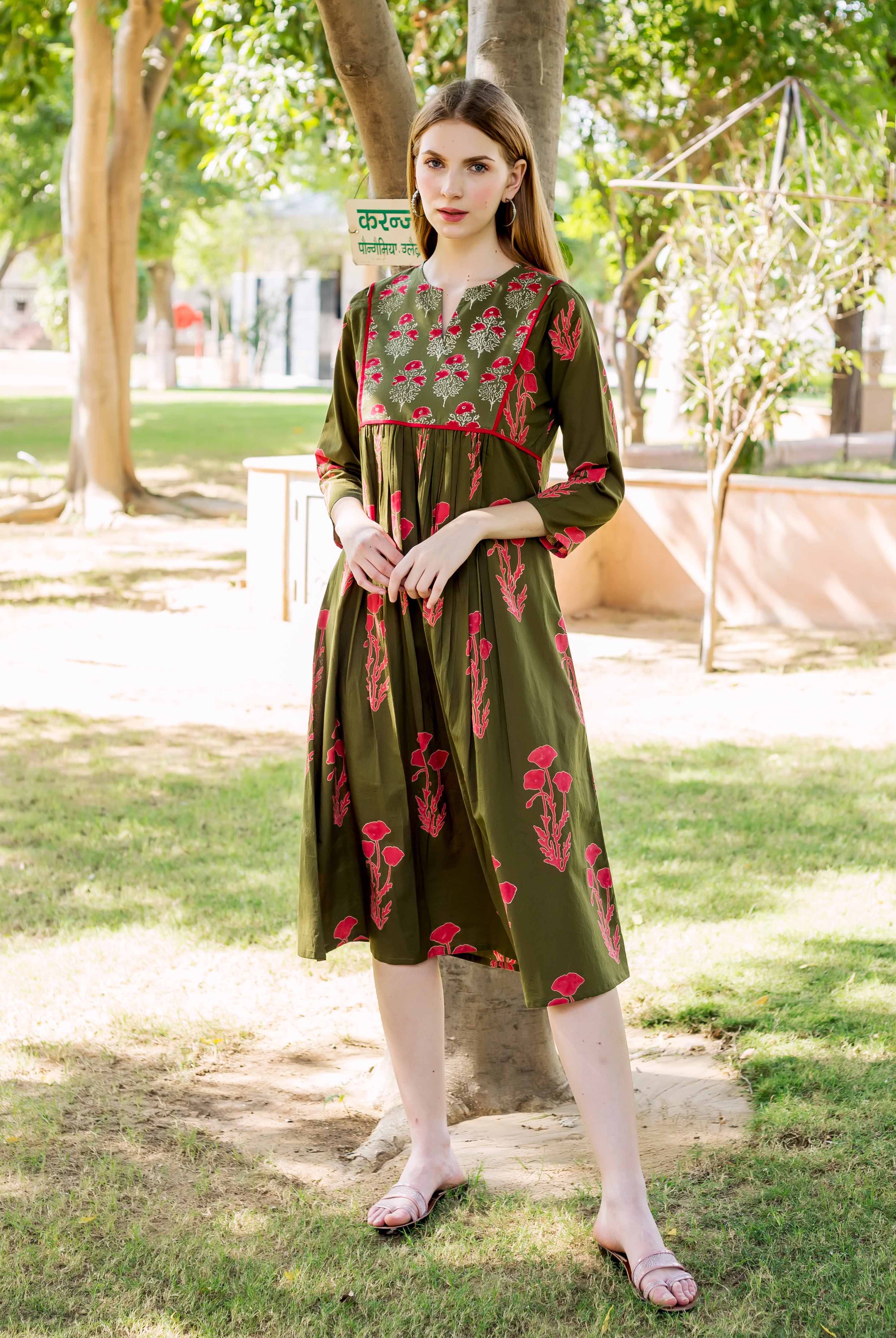 Olive green dress with red floral hand block print, modeled full-length, front-facing.