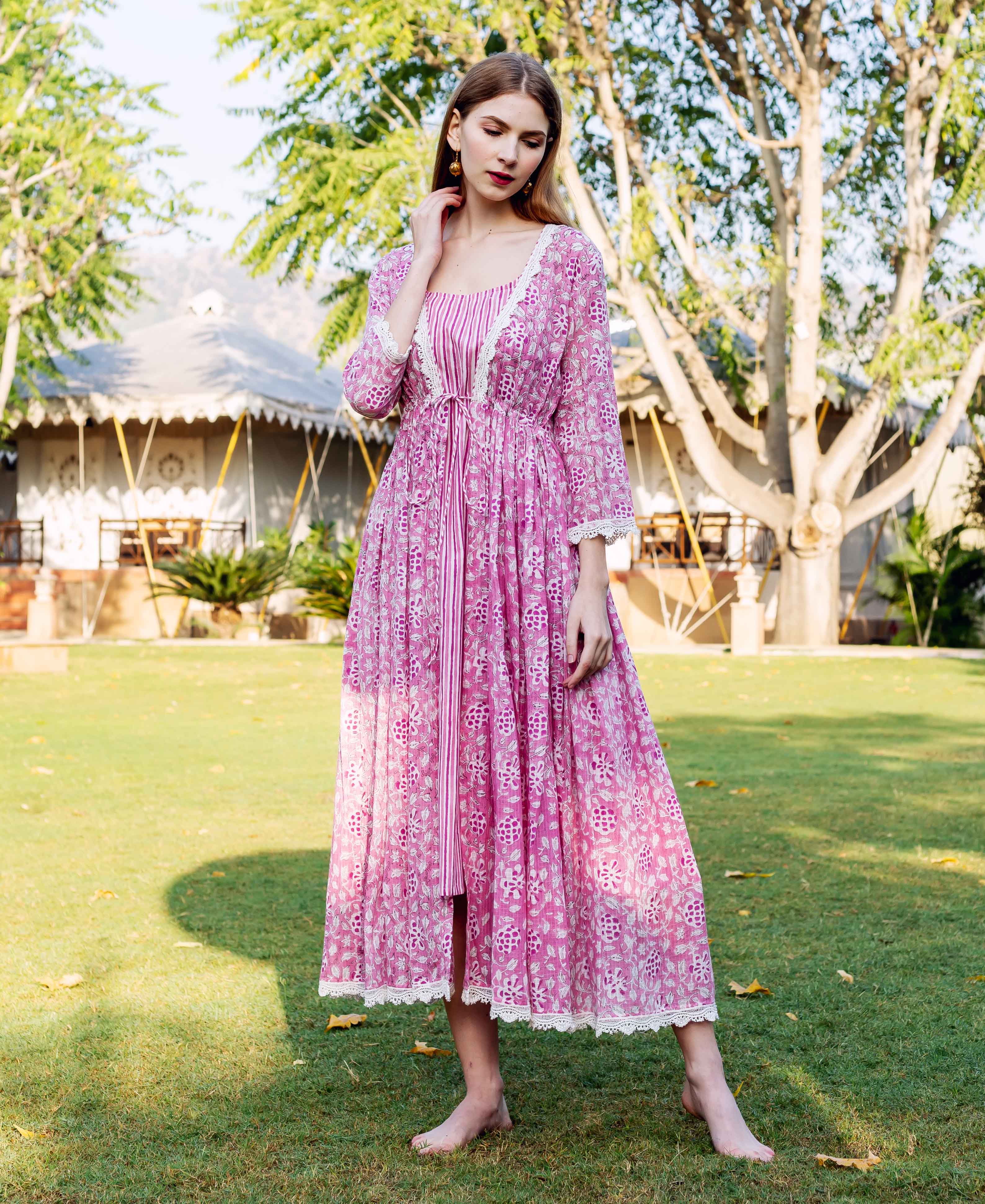 Front full-look of model in pink hand-block-printed ethnic floral jacket dress with stripes.