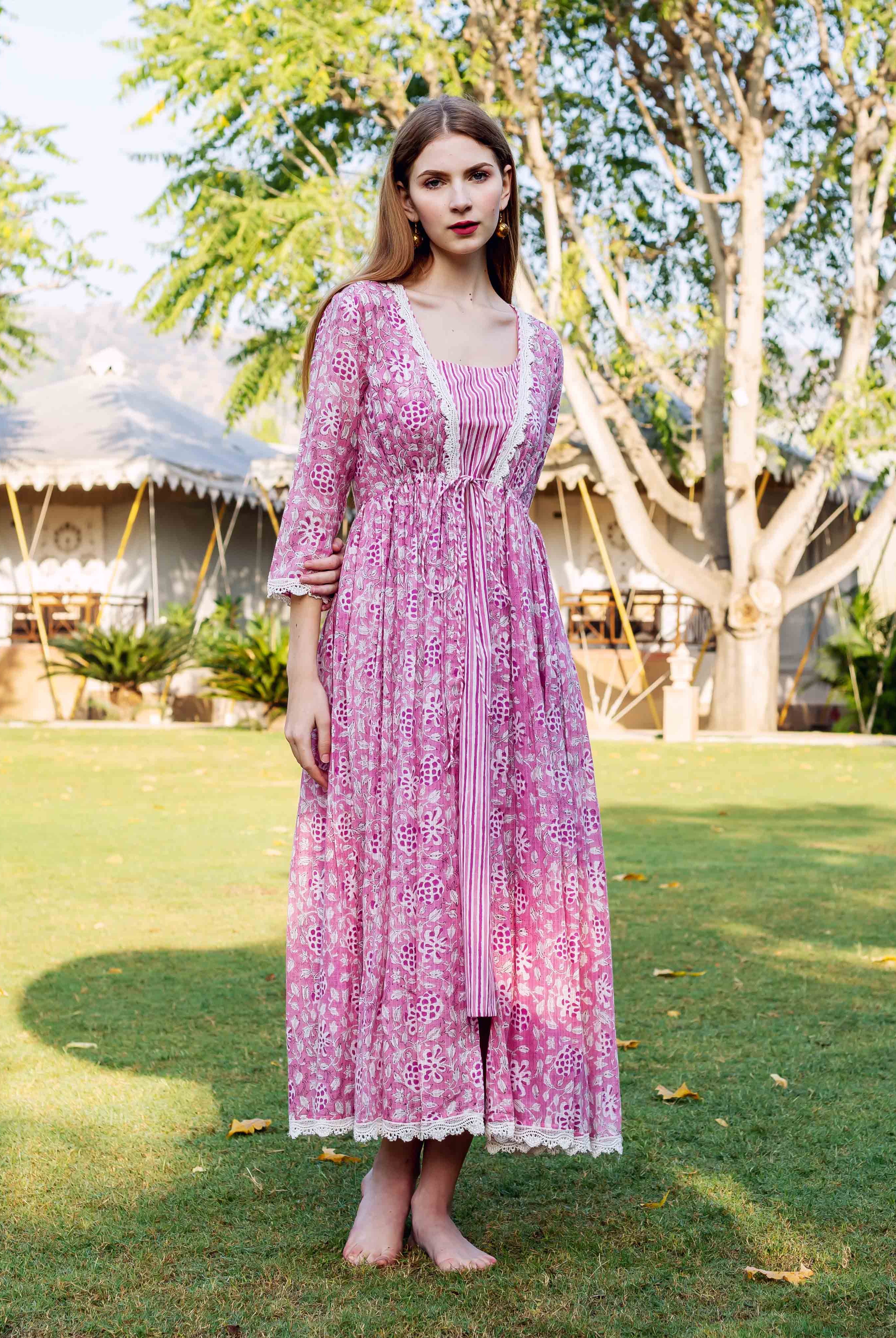 Front full look of model in pink hand-block-printed ethnic floral jacket dress.